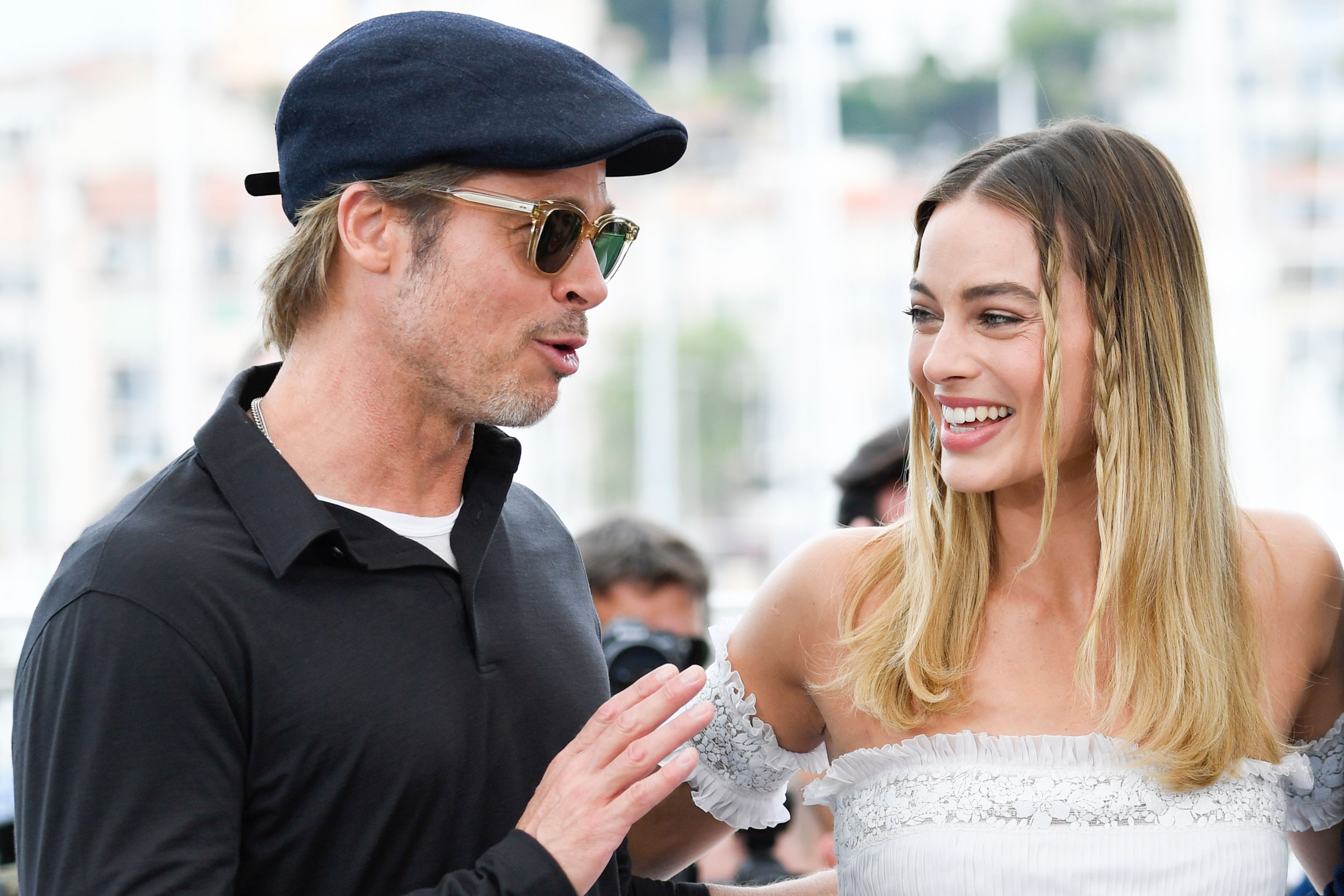 Brad Pitt and Margot Robbie smiling at Cannes Festival for Once Upon a Time in Hollywood