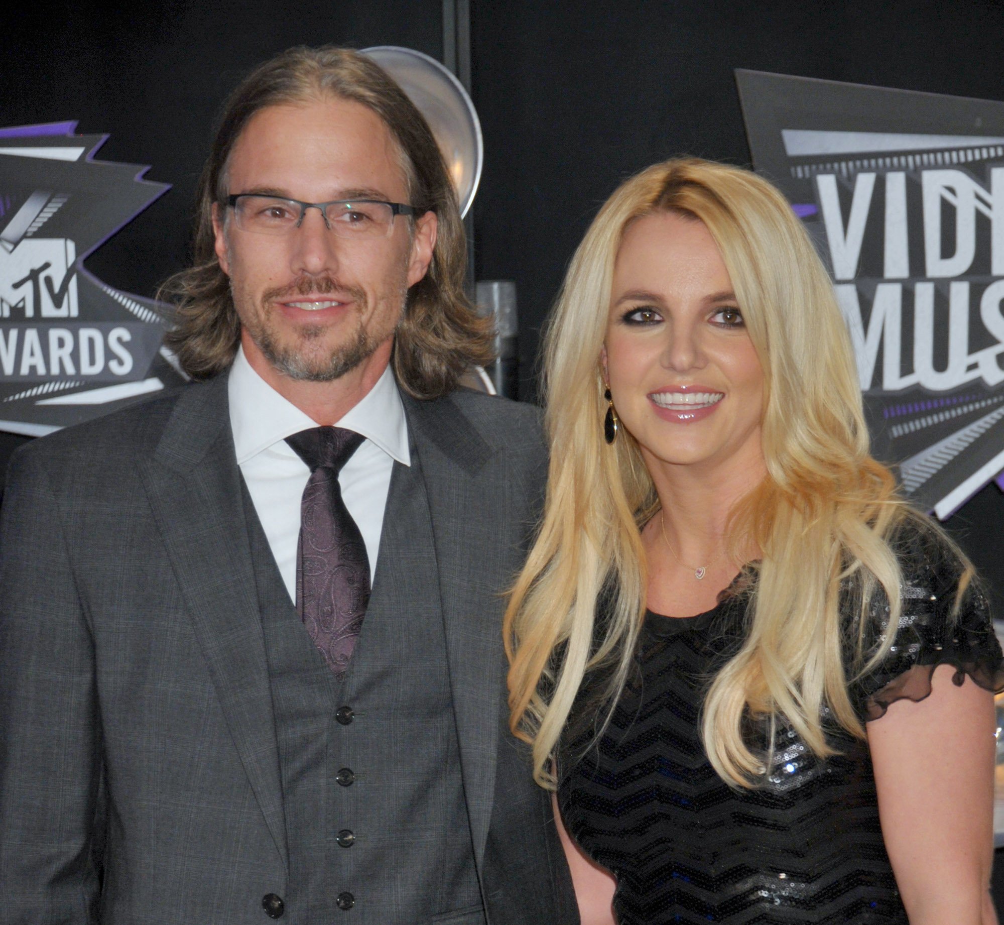 Brtiney Spears posing with her ex-fiancé Jason Trawick on the red carpet at the 2011 MTV Video Music Awards