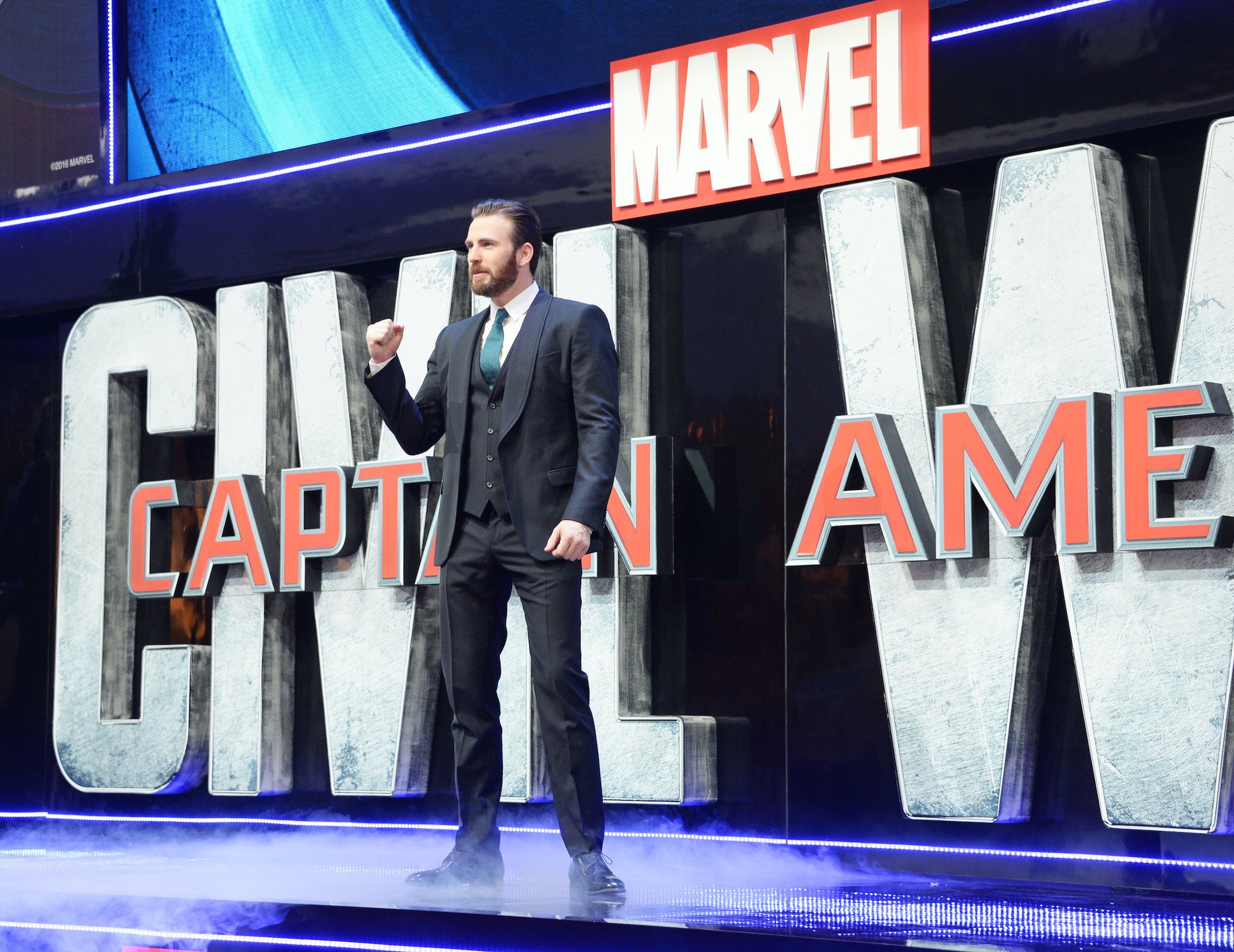 Chris Evans in front of a 'Captain America' logo