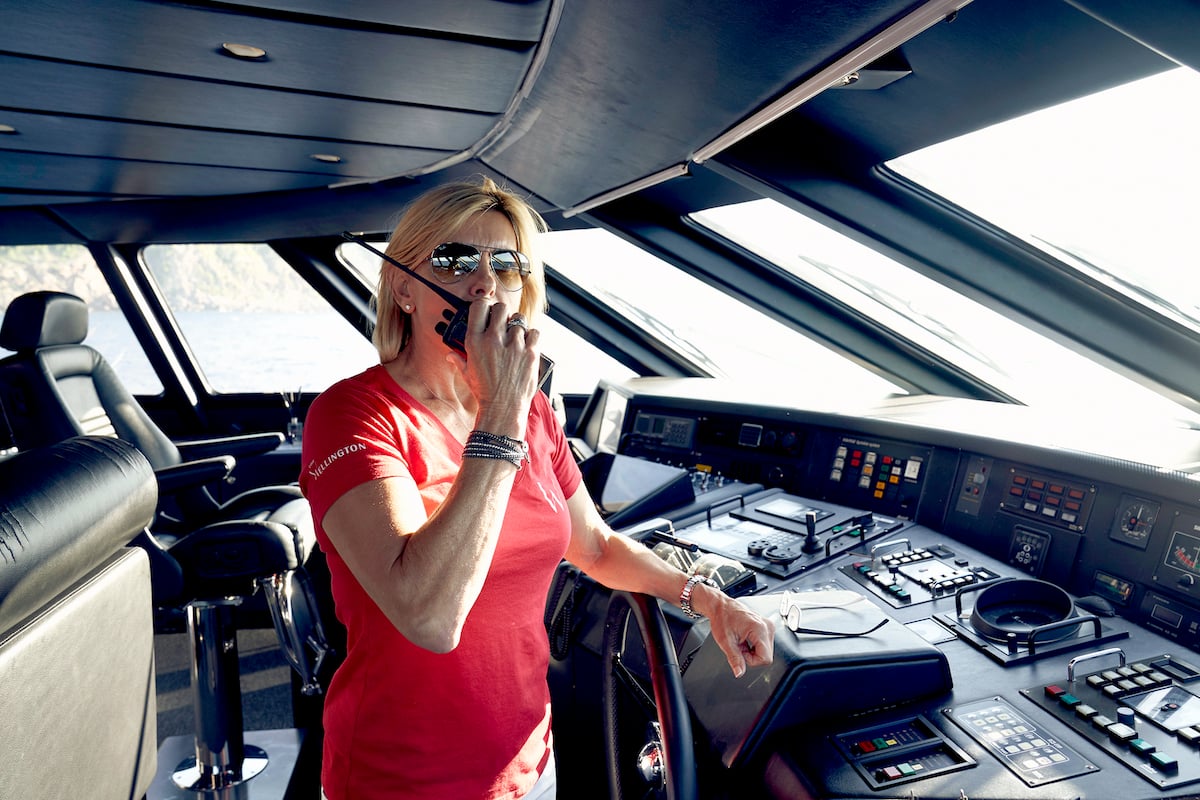 Captain Sandy Yawn from Below Deck Mediterranean works on the bridge of the boat