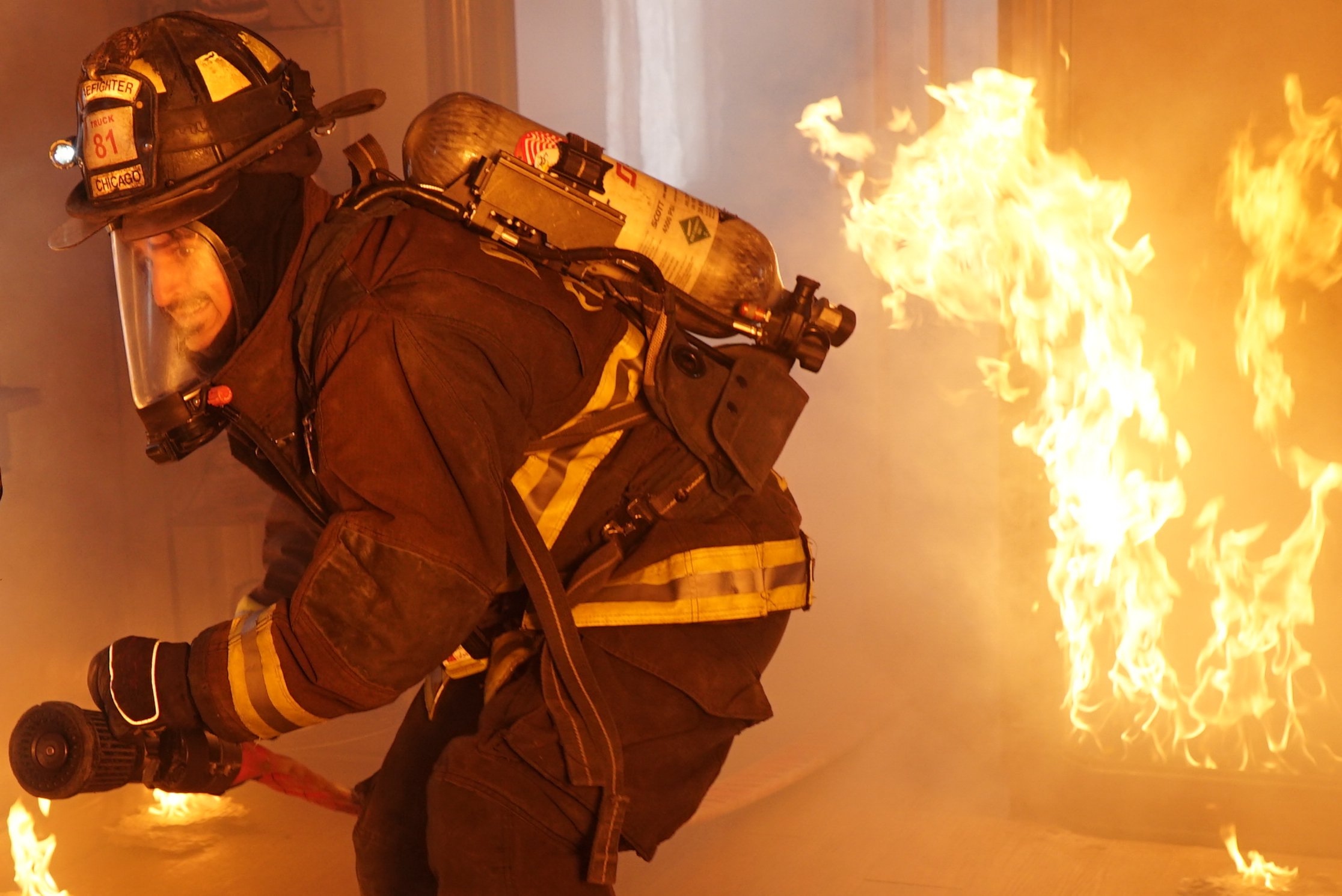 Yuri Sardarov as Otis battles a blaze in season 3 of 'Chicago Fire'