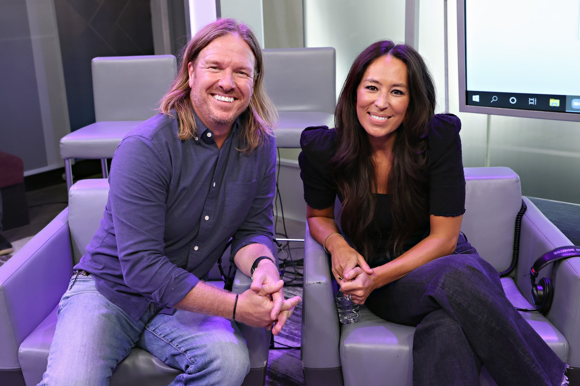Chip and Joanna Gaines smile while seated during an appearance on the TODAY Show radio event in July 2021