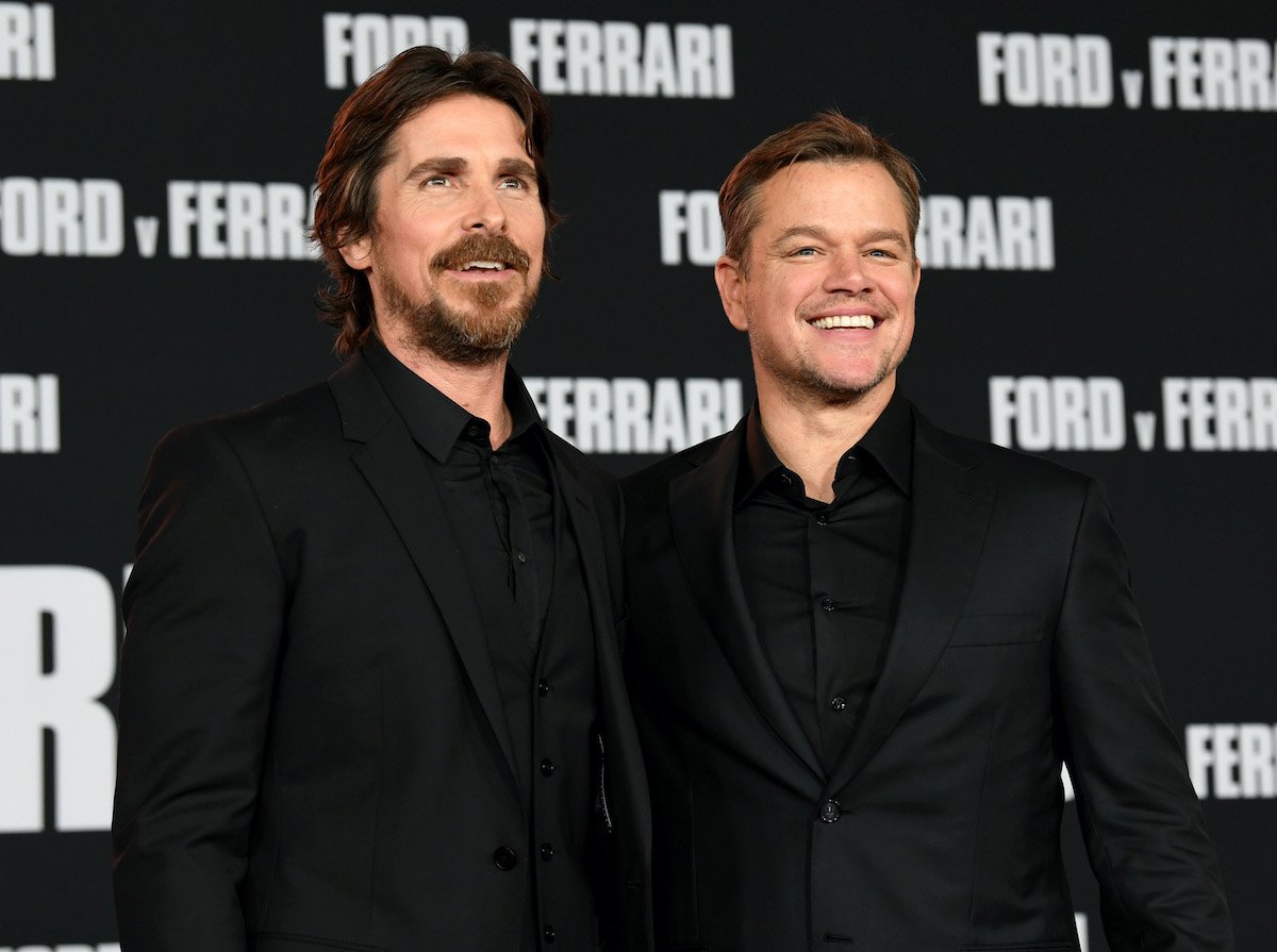 Christian Bale and Matt Damon smile and pose on the red carpet