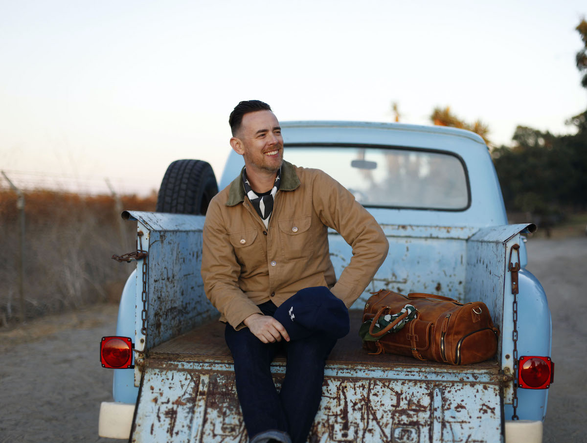 Colin Hanks on a pickup truck wearing Hanks Kerchiefs