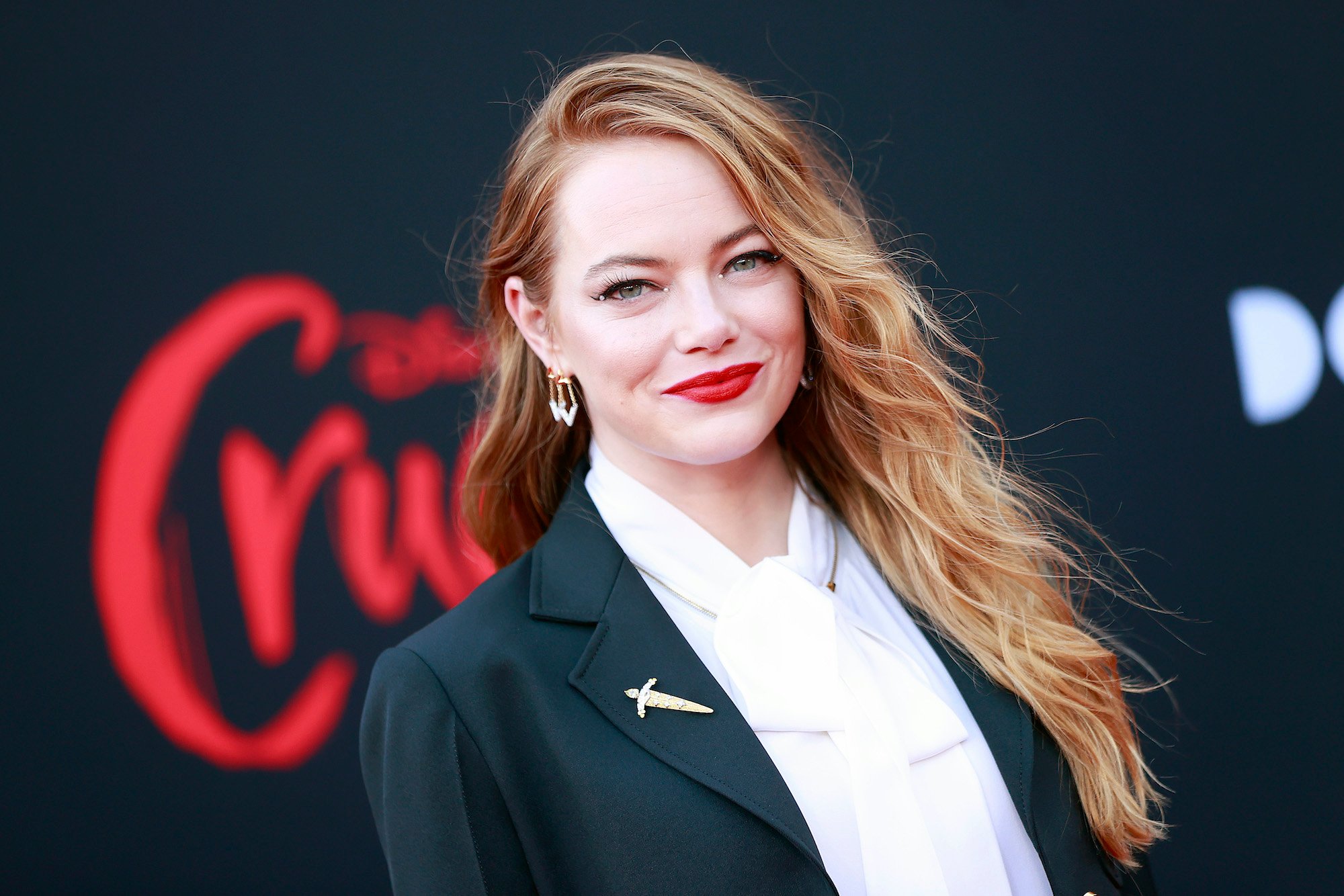 Emma Stone smiling at the 'Cruella' premiere