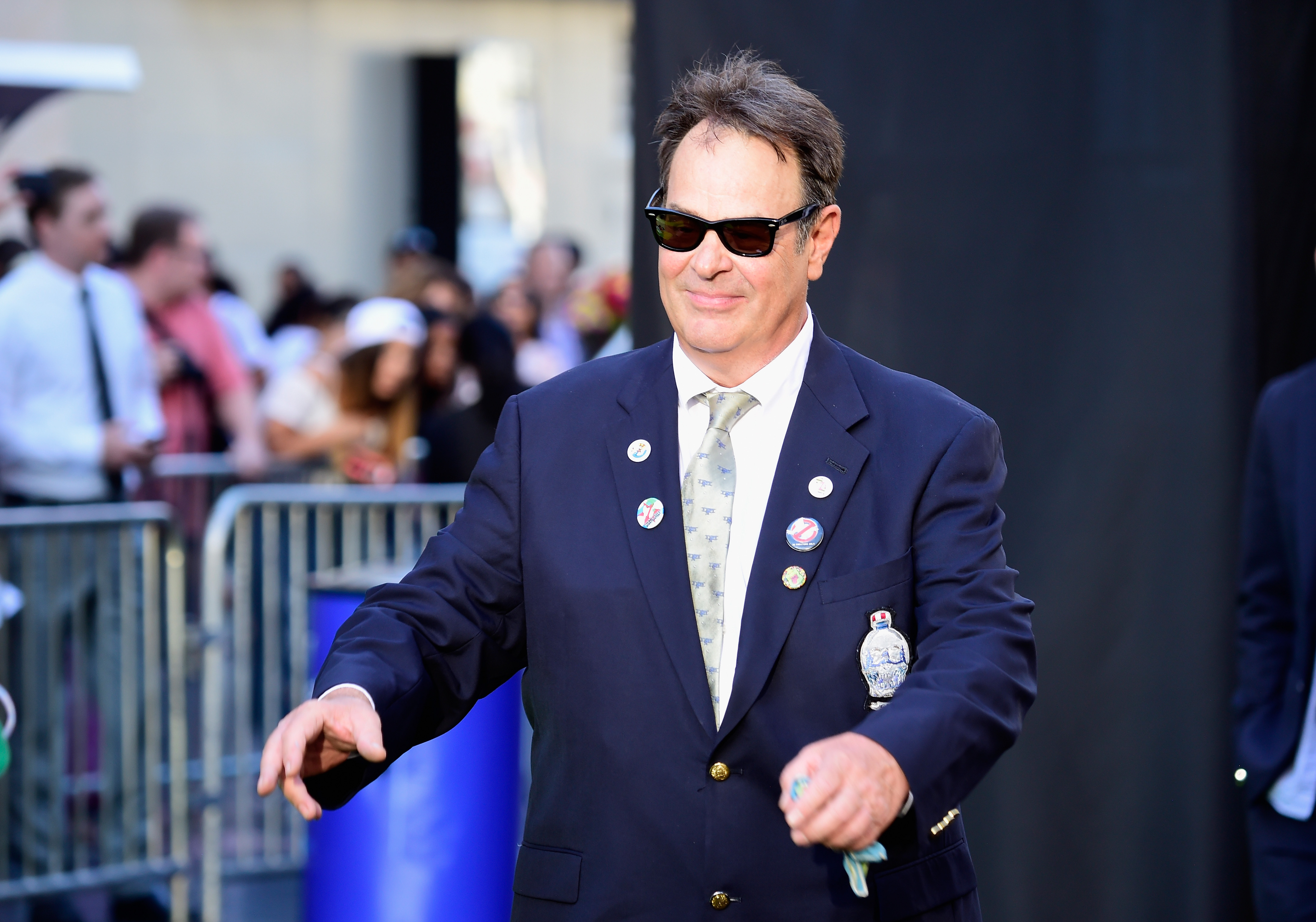 Actor Dan Aykroyd wears a suit and sunglasses as he attends the premiere o the 2016 film 'Ghostbusters.'