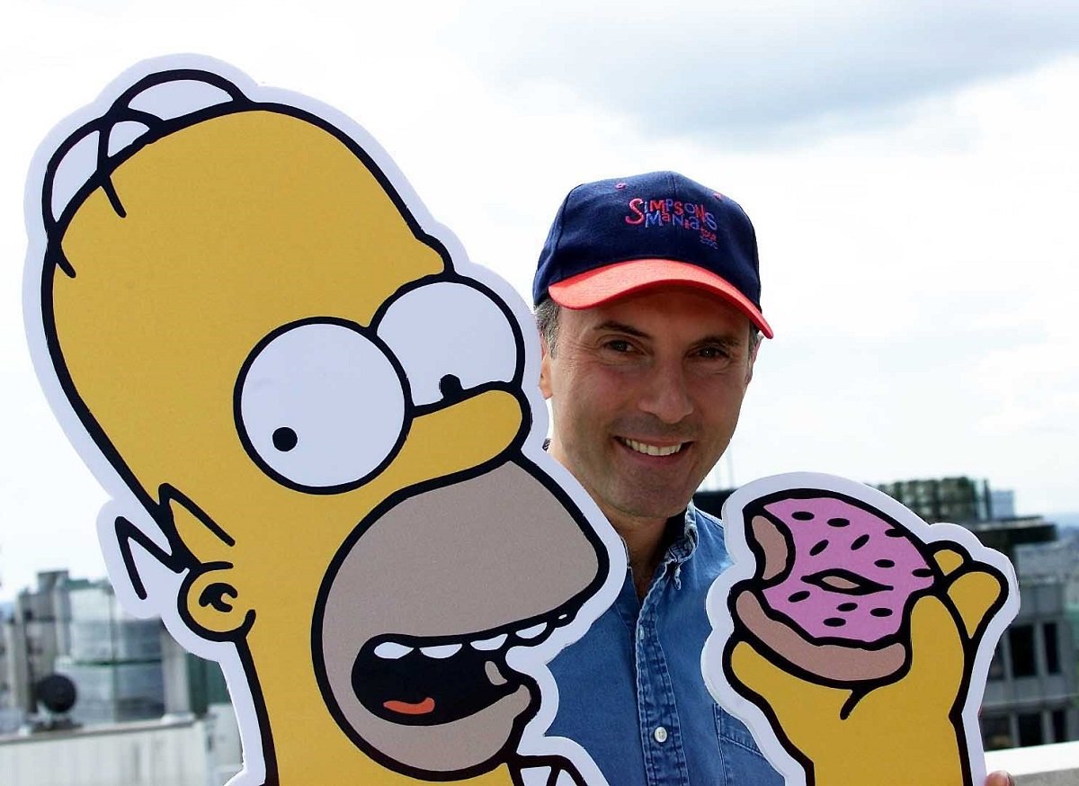'The Simpsons' voice actor Dan Castellaneta poses with a cutout of his character Homer Simpson during a 2000 event in London.