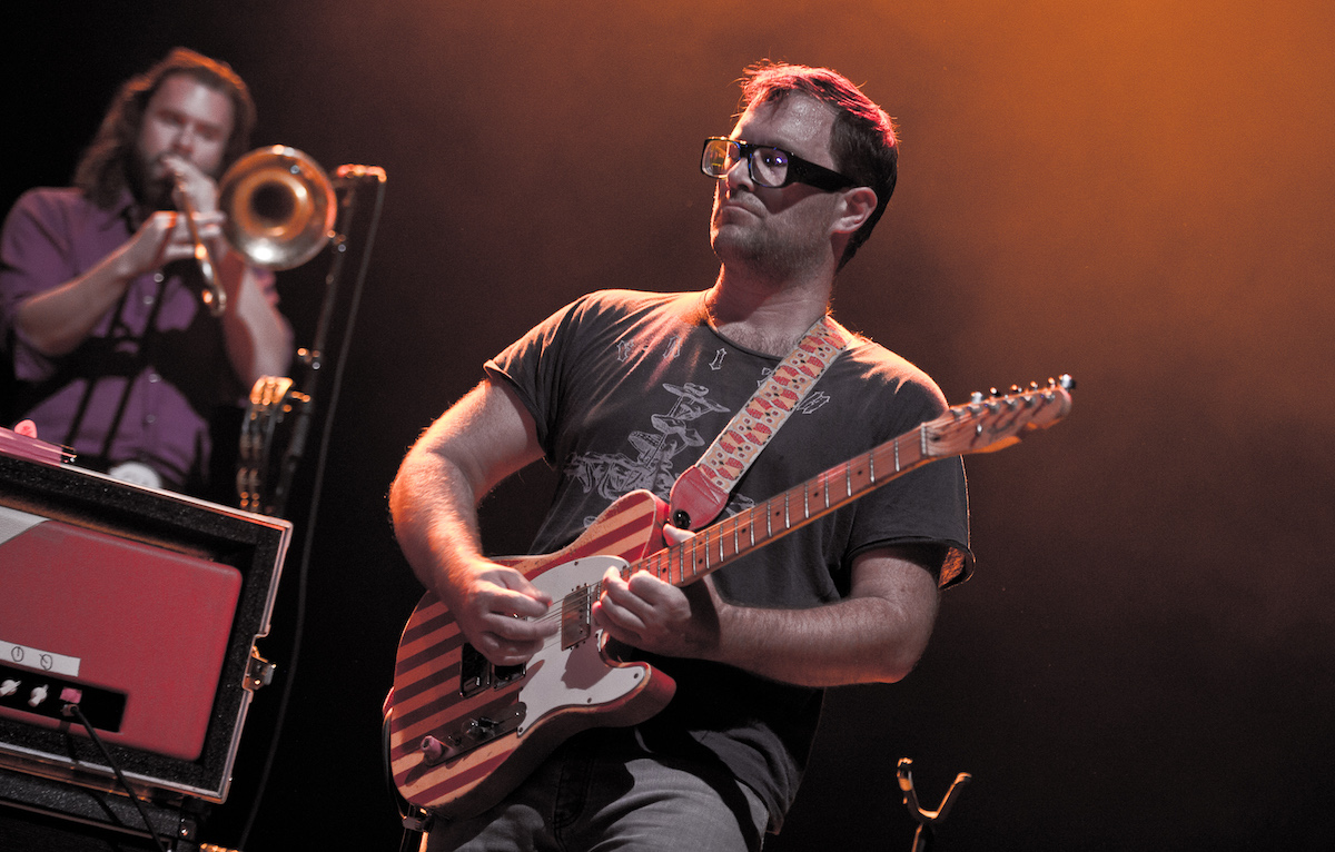 David Sitek performs on stage.