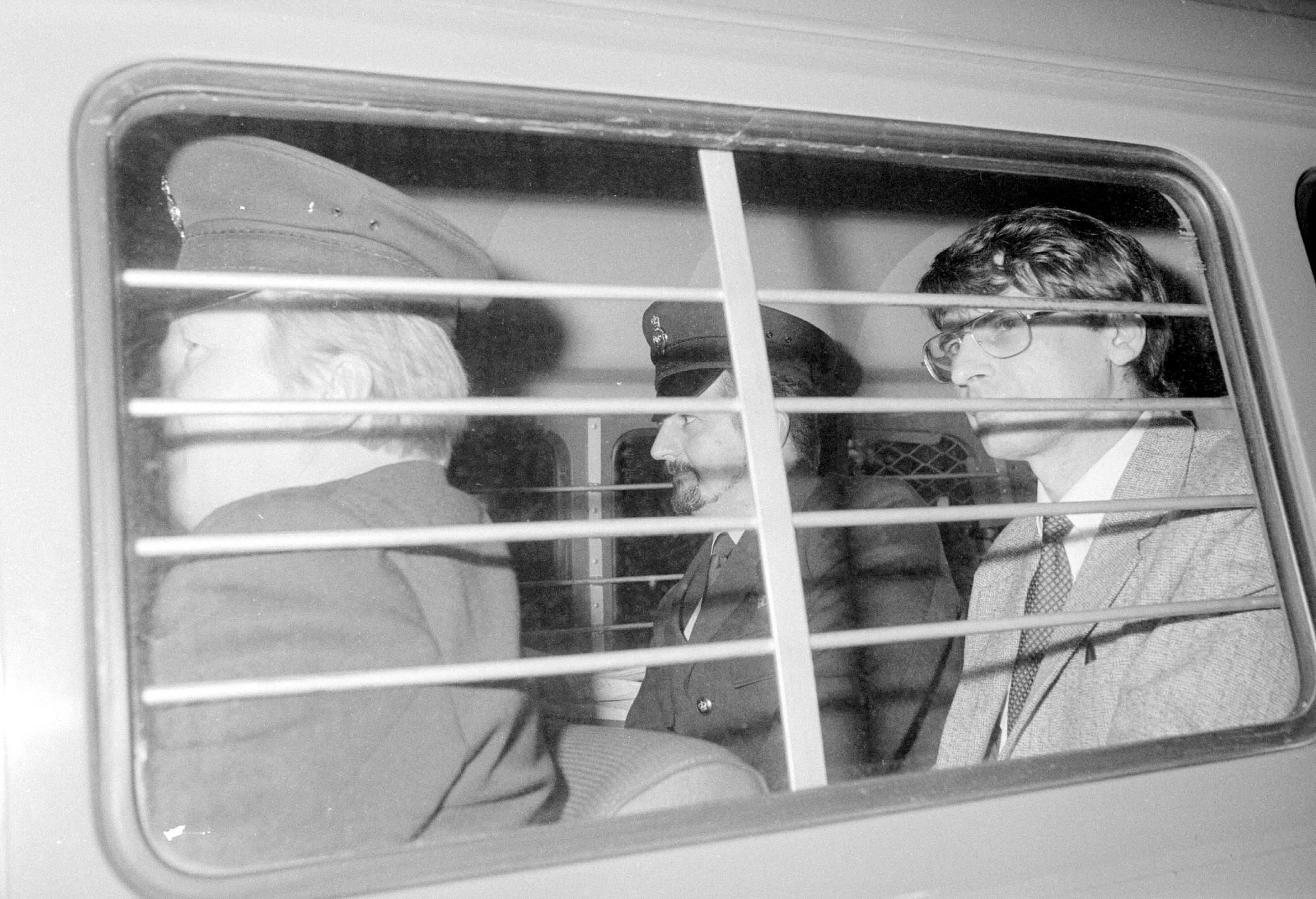 Black and white photo of serial killer Dennis Nilsen in a police car