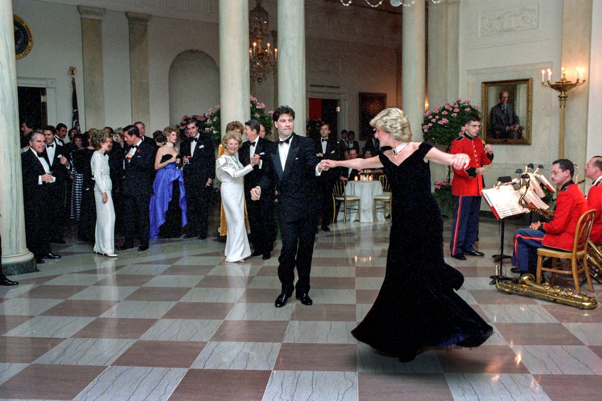 John Travolta and Princess Diana dancing in formal wear