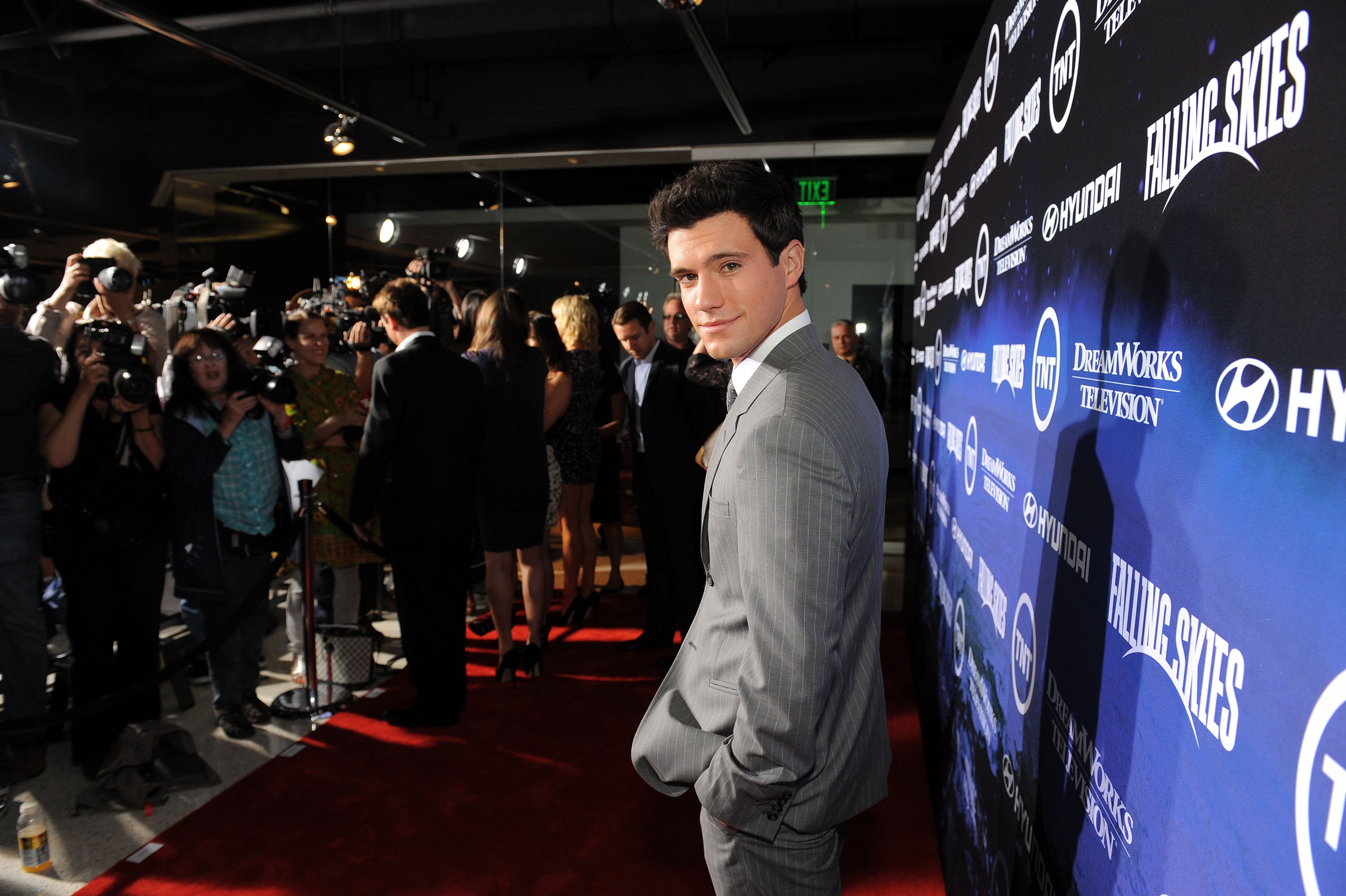 Drew Roy smiling at the premiere of TNT's "Falling Skies"