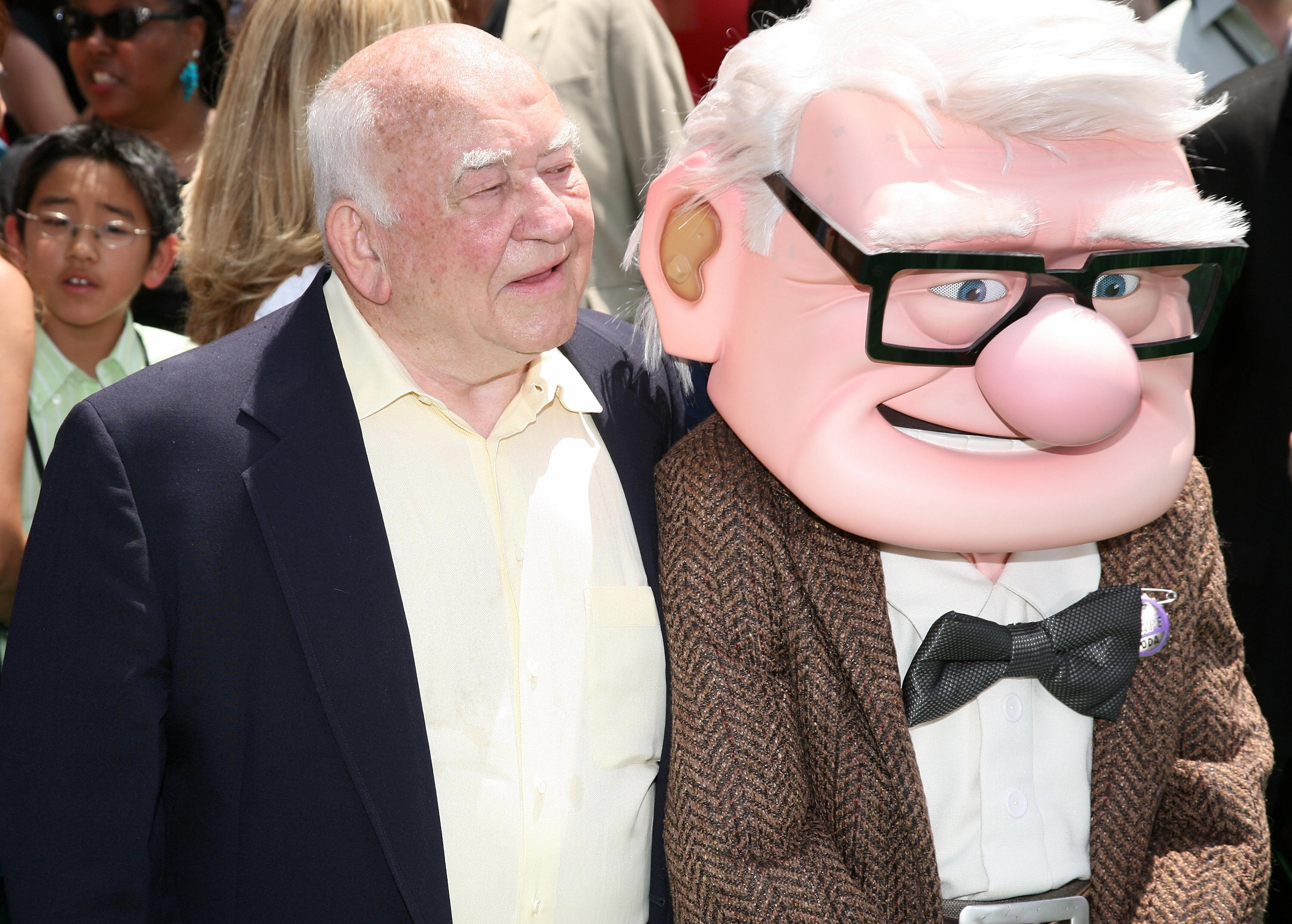 Ed Asner puts his arm around Carl from Up