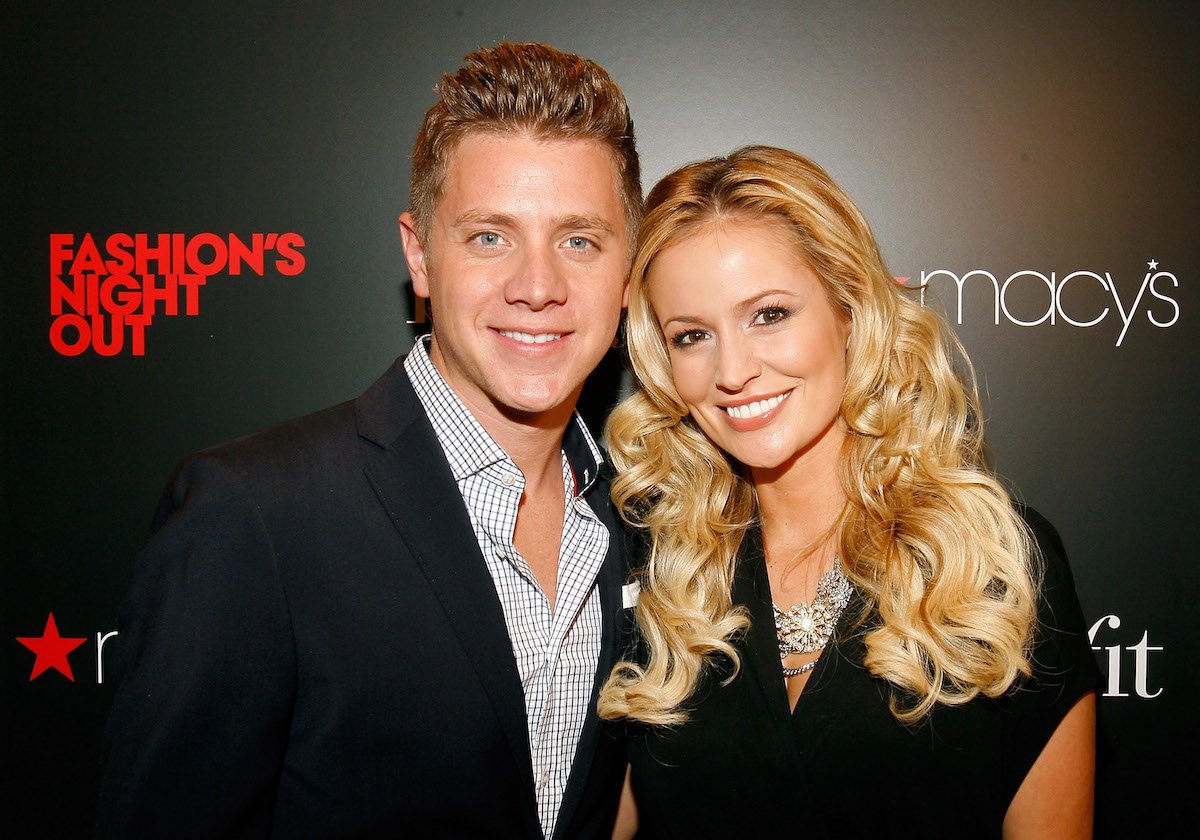 Jef Holm and Emily Maynard face the camera and smile.