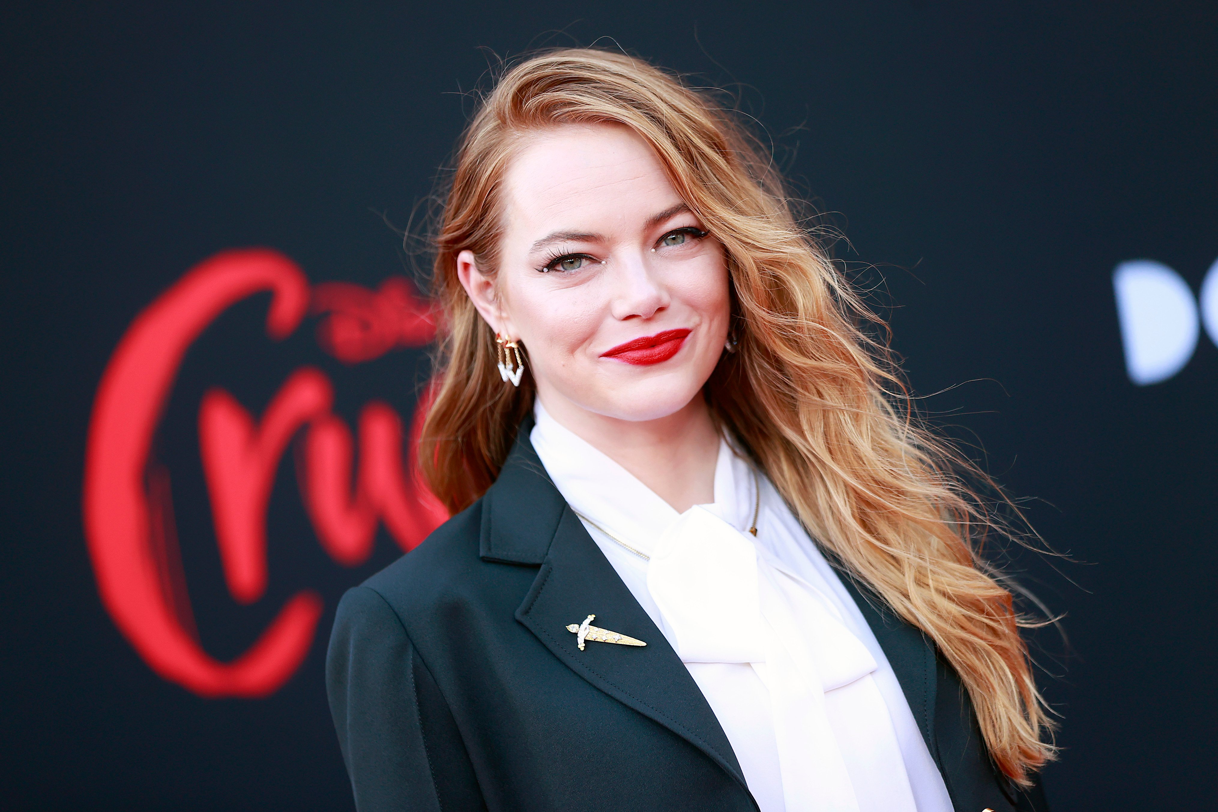 Emma Stone smiling at 'Cruella' premiere