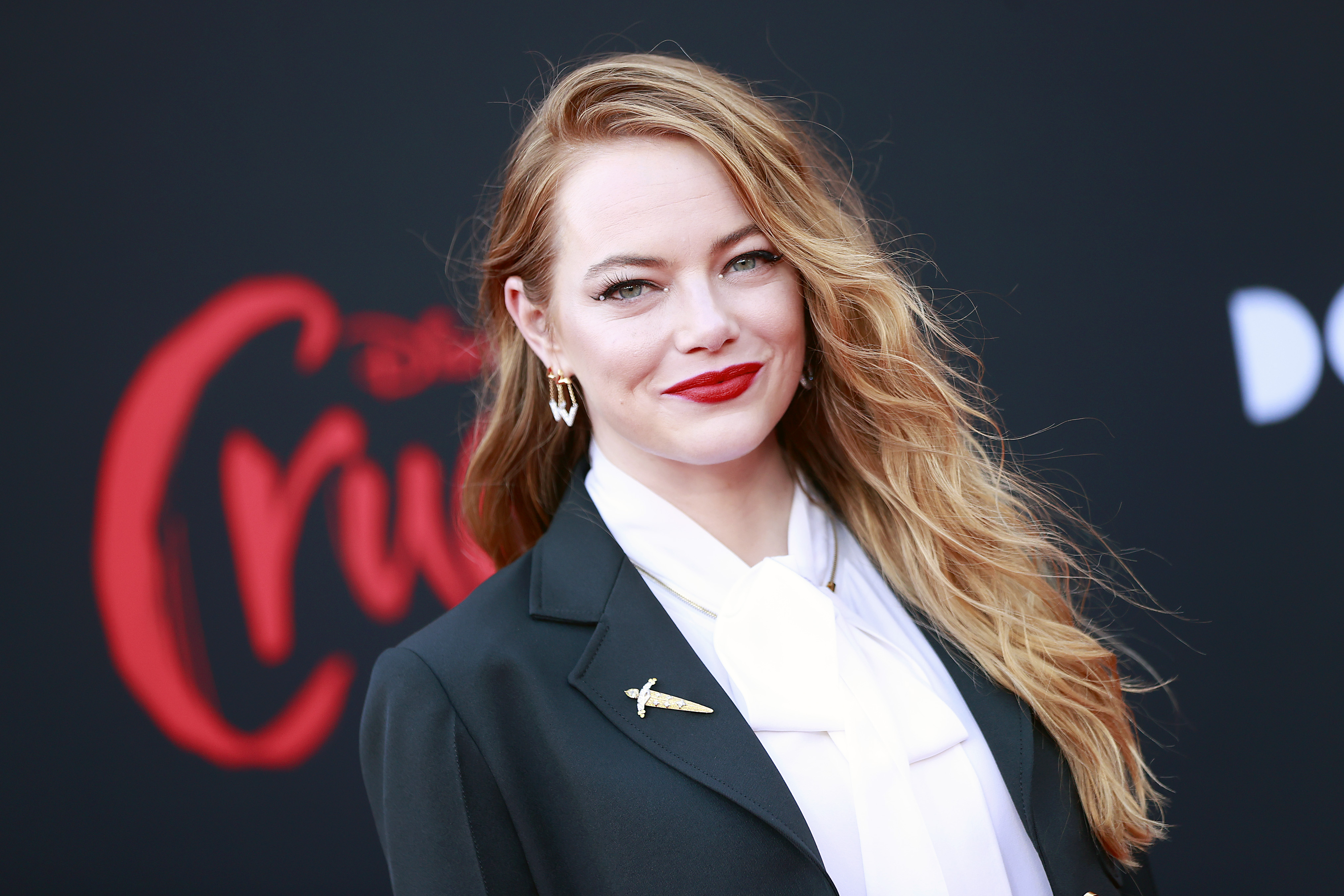 Emma Stone smiling at 'Cruella' premiere