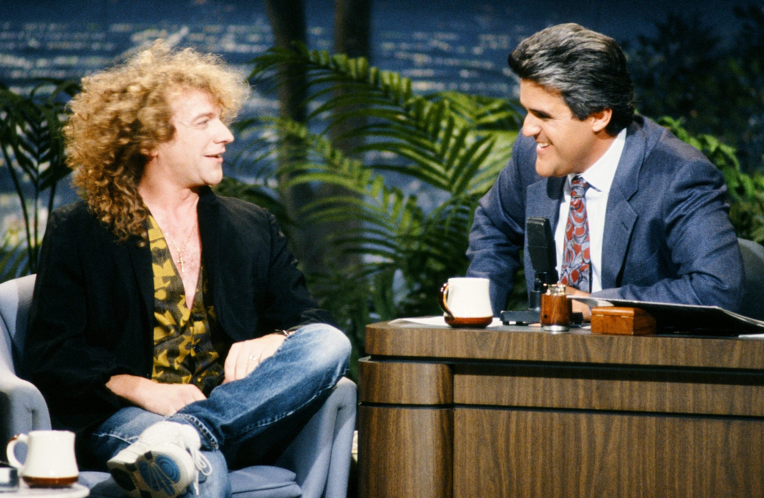 (left to right): Former Foreigner lead singer Lou Gramm, who gave 'Waiting For a Girl Like You' its soul, sat down with late-night show host Jay Leno in 1990