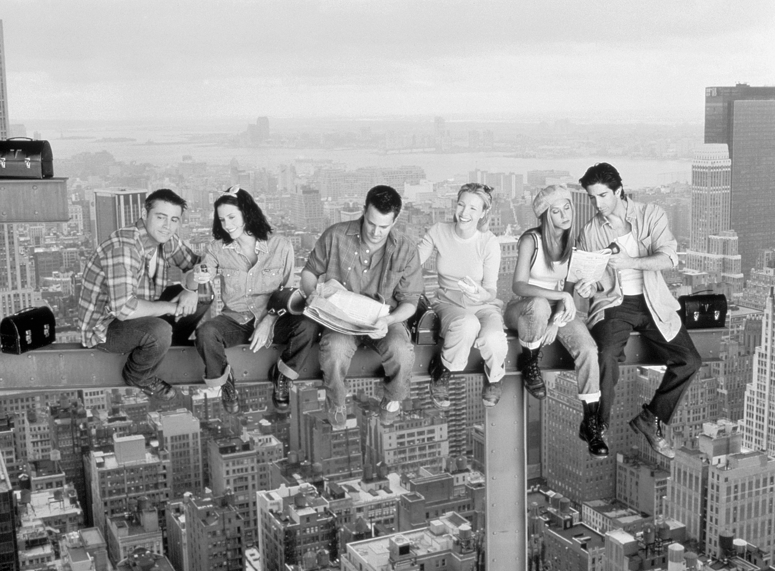 Matt LeBlanc as Joey Tribbiani, Courteney Cox as Monica Geller, Matthew Perry as Chandler Bing, Lisa Kudrow as Phoebe Buffay, Jennifer Aniston as Rachel Green and David Schwimmer as Ross Geller sit on a steel beem for a promotional photo shoot for 'Friends'