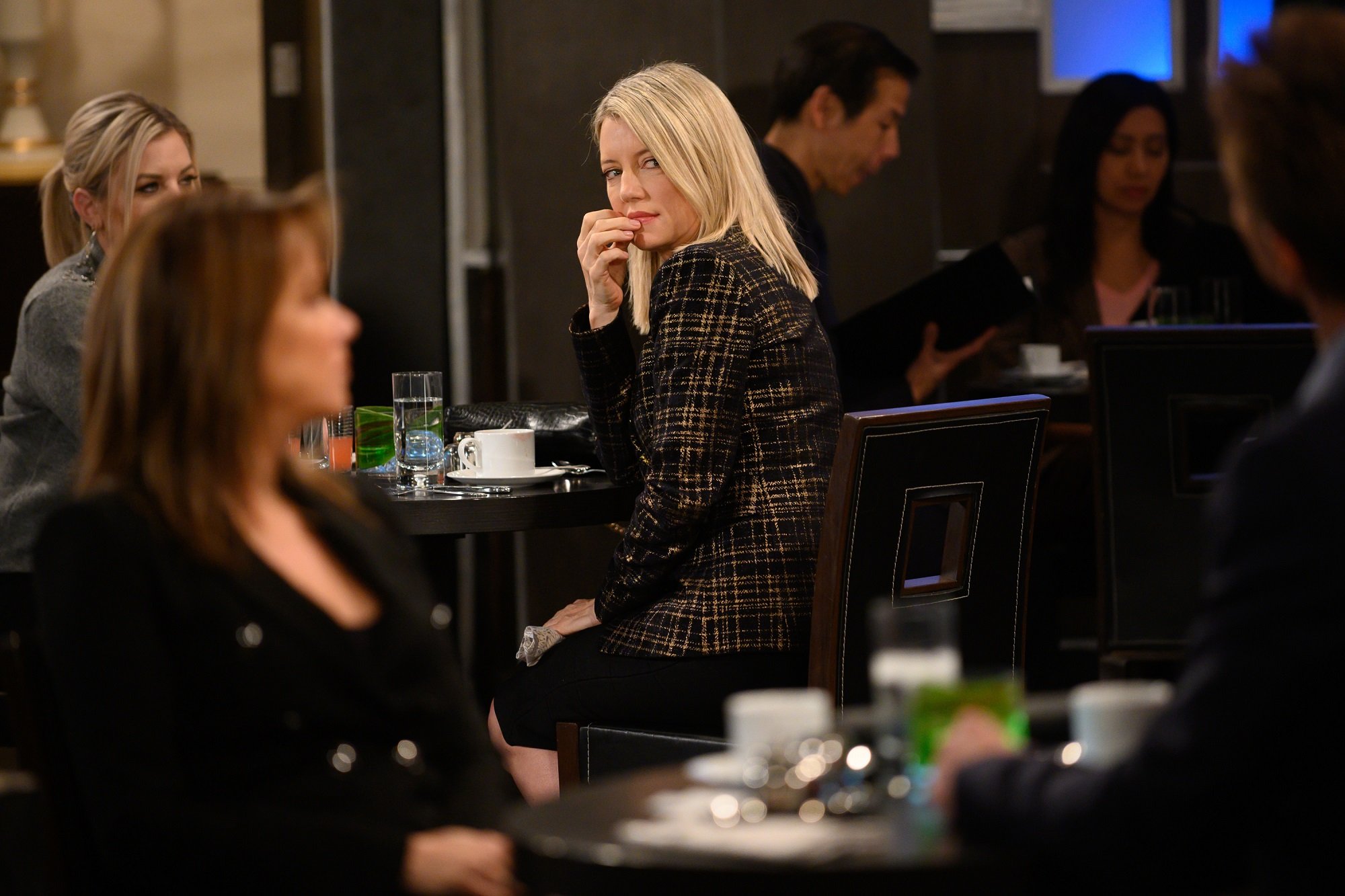 General Hospital spoilers may have Nina - pictured here in a tweed sweater in a restaurant - revealing the truth about Sonny