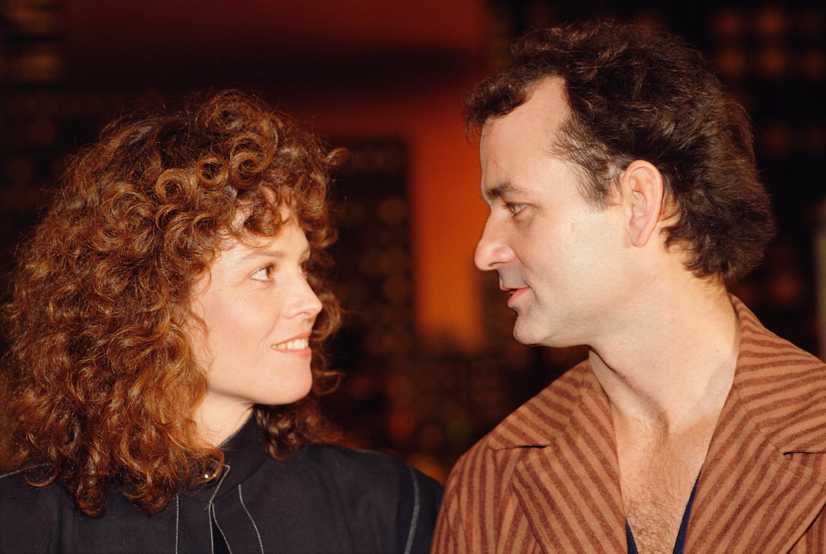 Bill Murray and Sigourney Weaver looking at one another at the 'Ghostbusters' premiere.