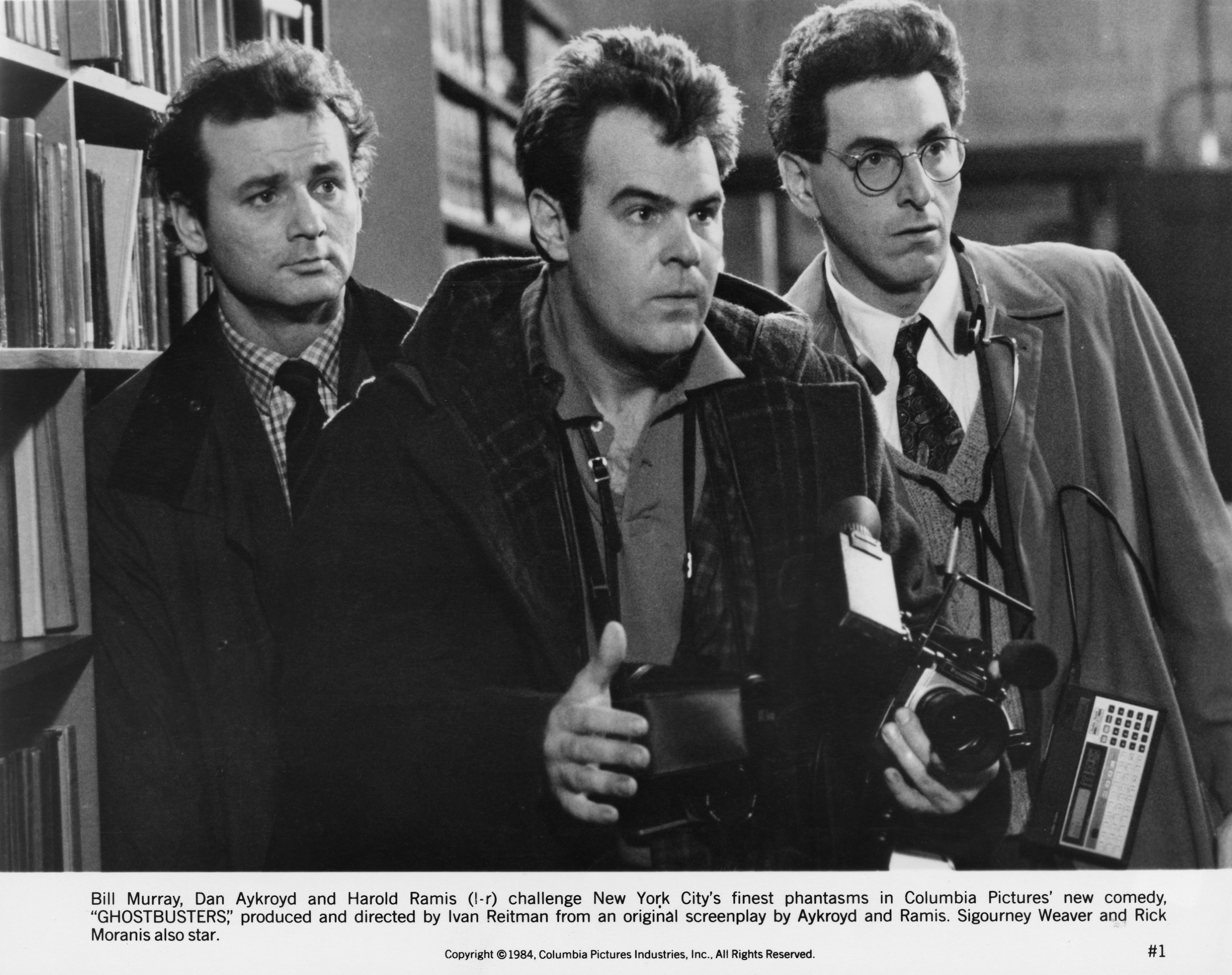 Black and white photo of Bill Murray, Dan Aykroyd, and Harold Ramis in a scene from the 1984 film 'Ghostbusters.'