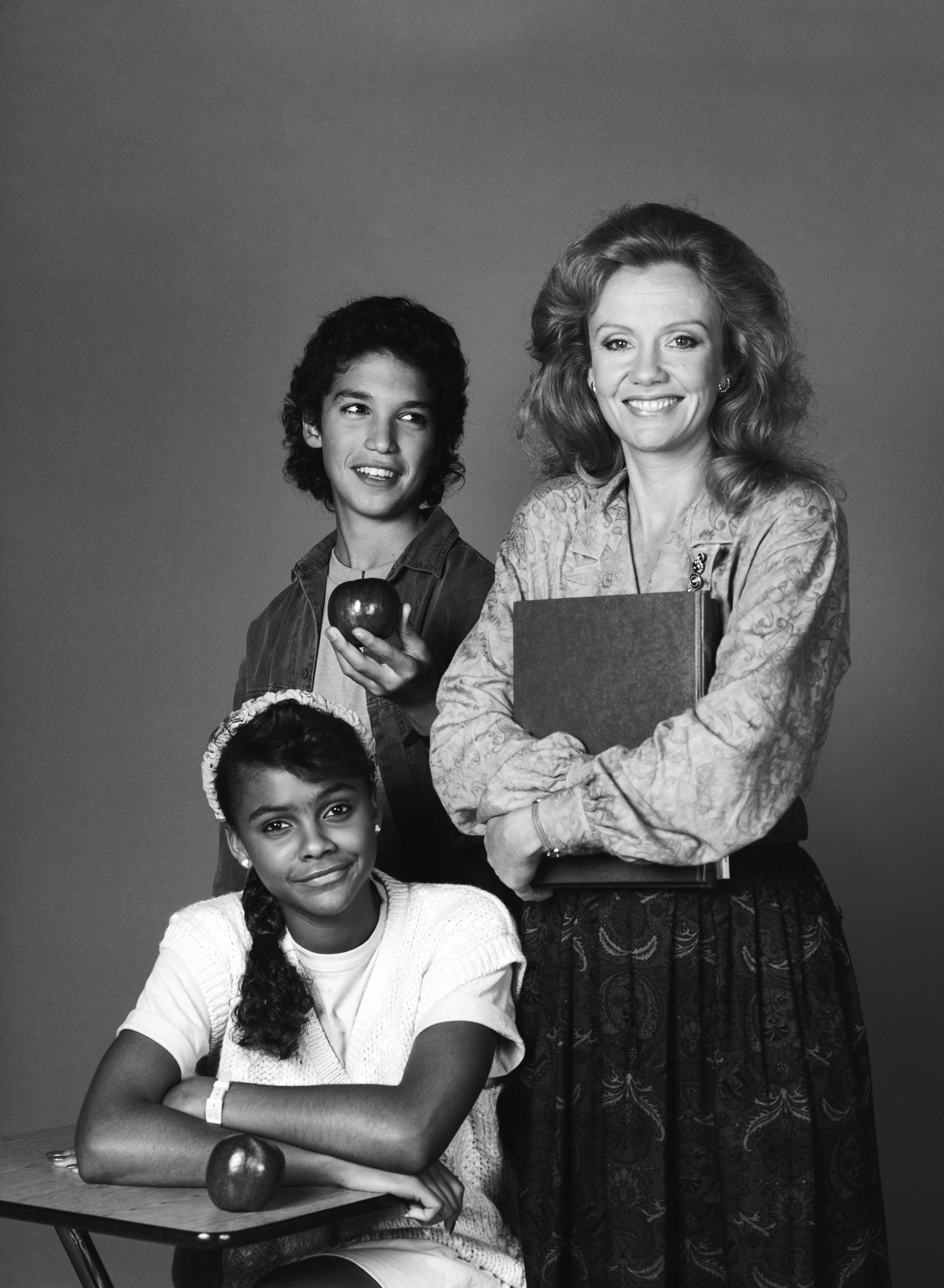 Max Battimo as Mikey, Lark Voorhies as Lisa, and Hayley Mills as Miss Bliss pose for a promotional photo for 'Good Morning, Miss Bliss'