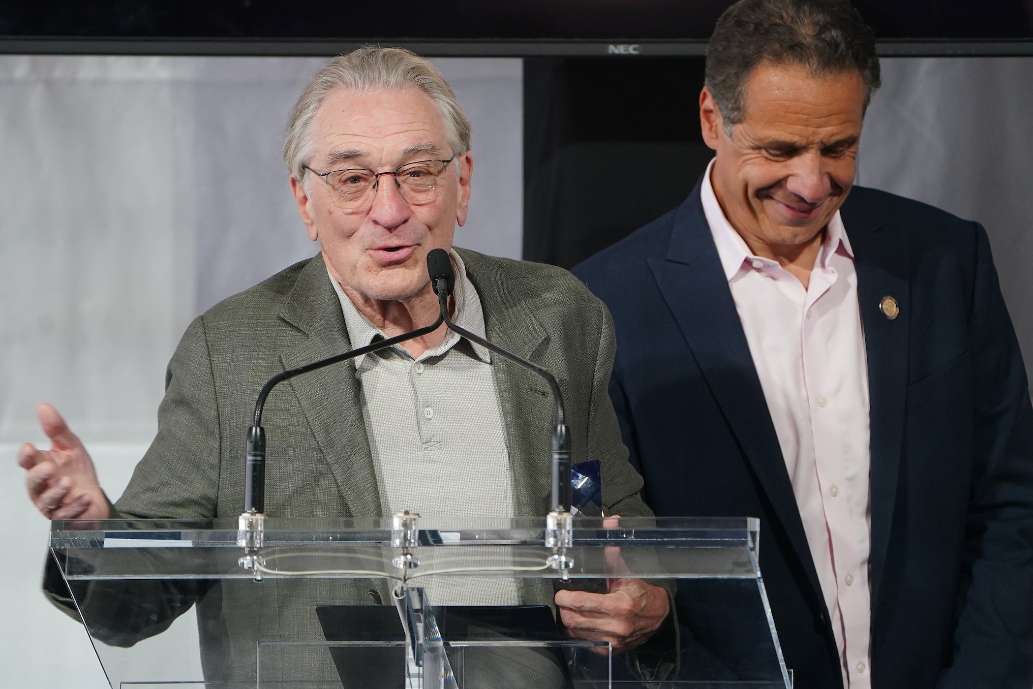 Robert De Niro speaking at the Tribeca Film Festival next to Andrew Cuomo