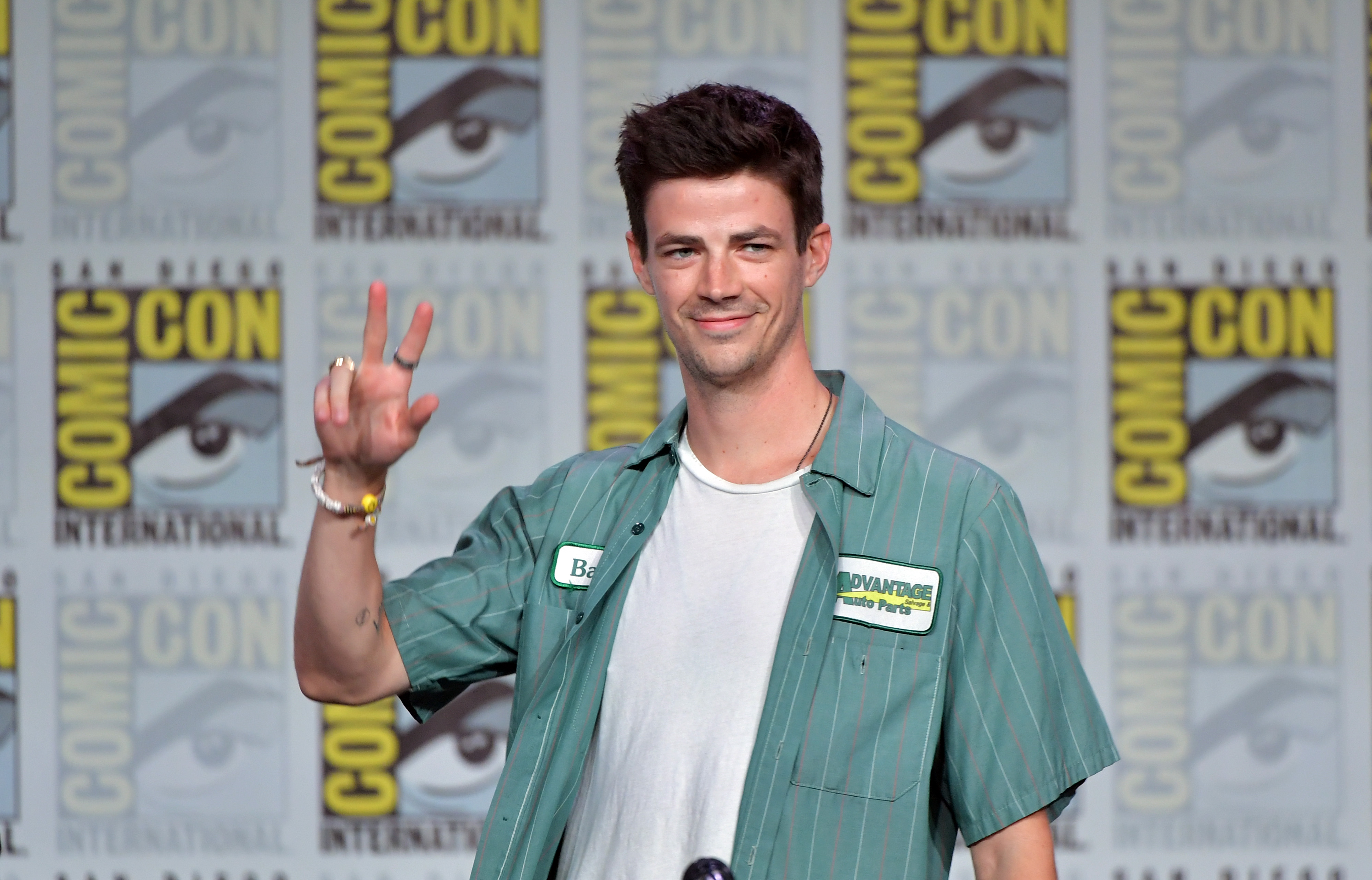Grant Gustin, from the Arrowverse, arrives on stage at San Diego Comic Con in 2019.