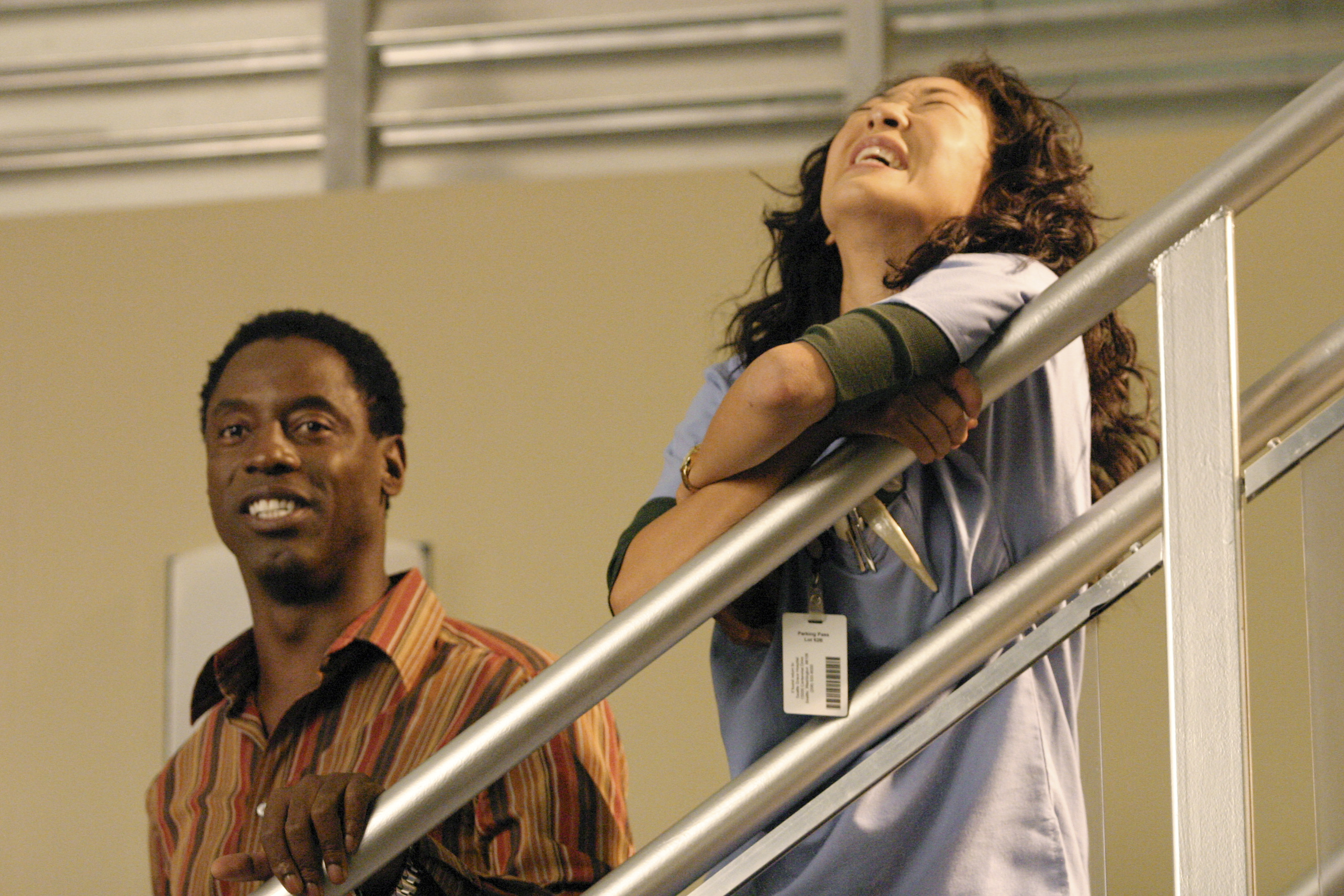 'Grey's Anatomy' stars Sandra Oh as Cristina Yang and Isaiah Washington as Preston Burke laughing during a scene.