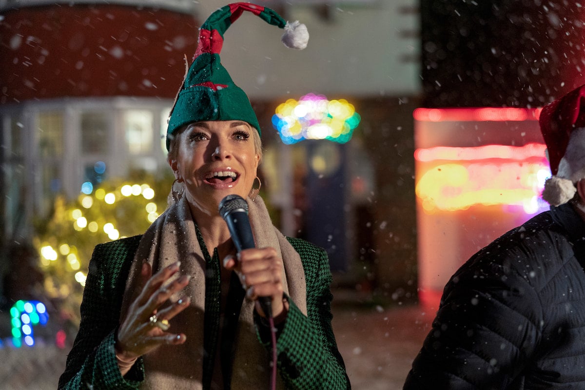 Hannah Waddingham wears an elf hat and sings into a mic in 'Ted Lasso' Season 2
