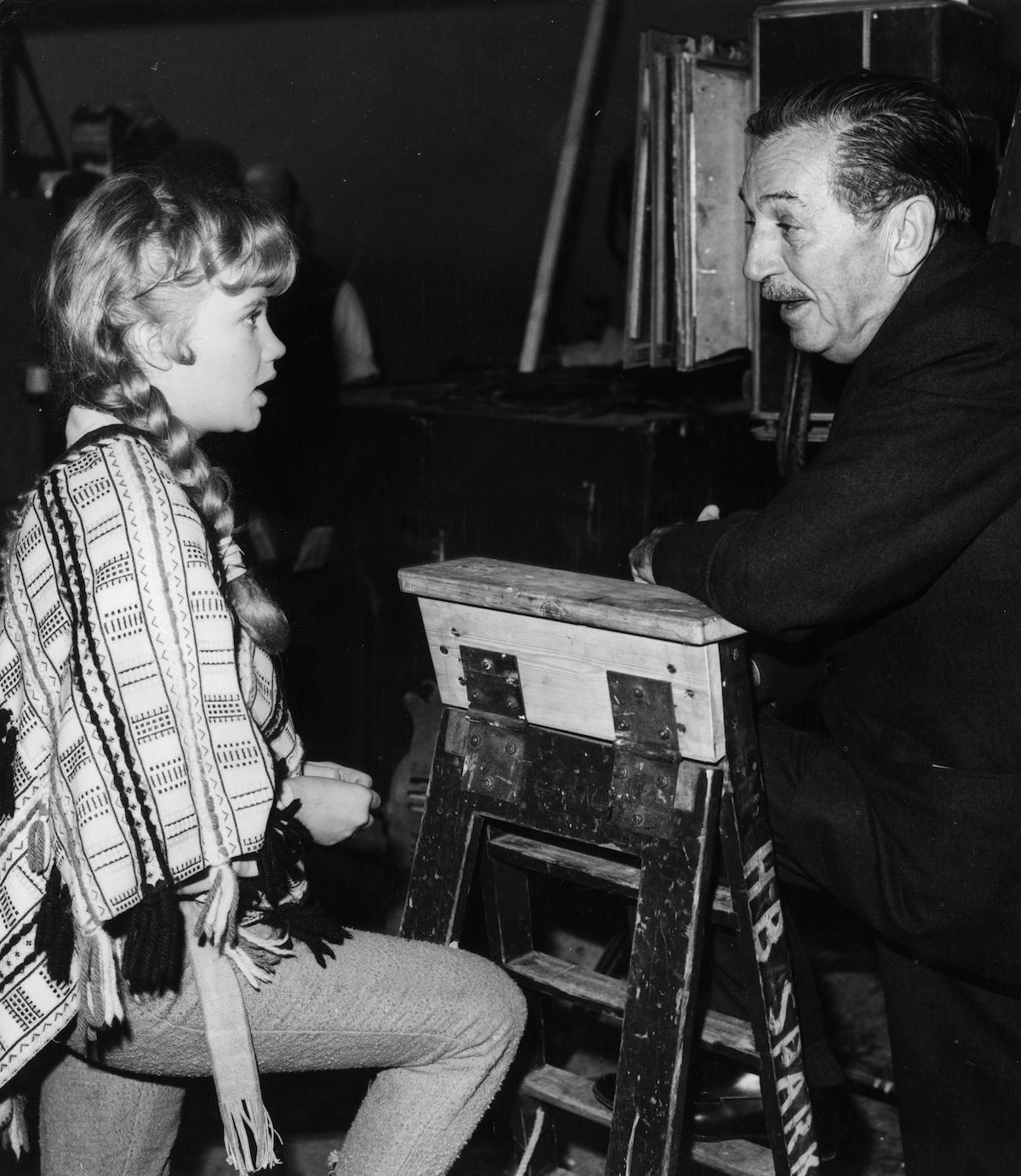 Hayley Mills and Walt Disney in a black and white photo