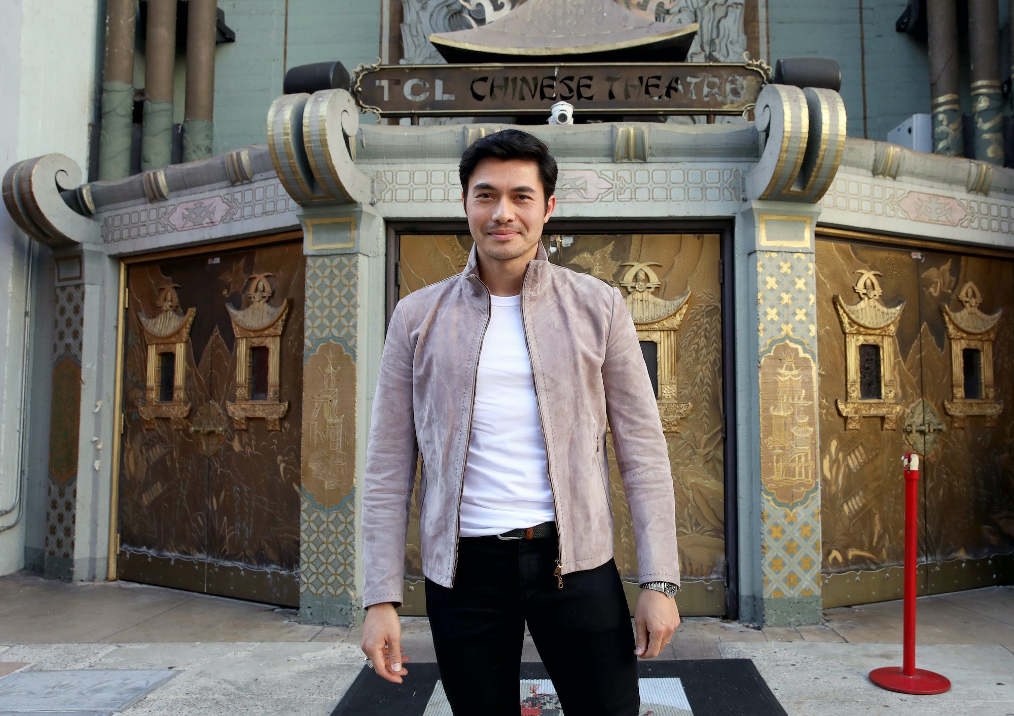 Henry Golding smiling