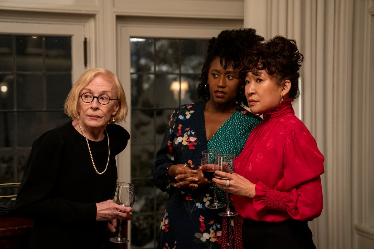 Holland Taylor, Nana Mensah, and Sandra Oh stand together each holding a glass of wine in 'The Chair' Season 1