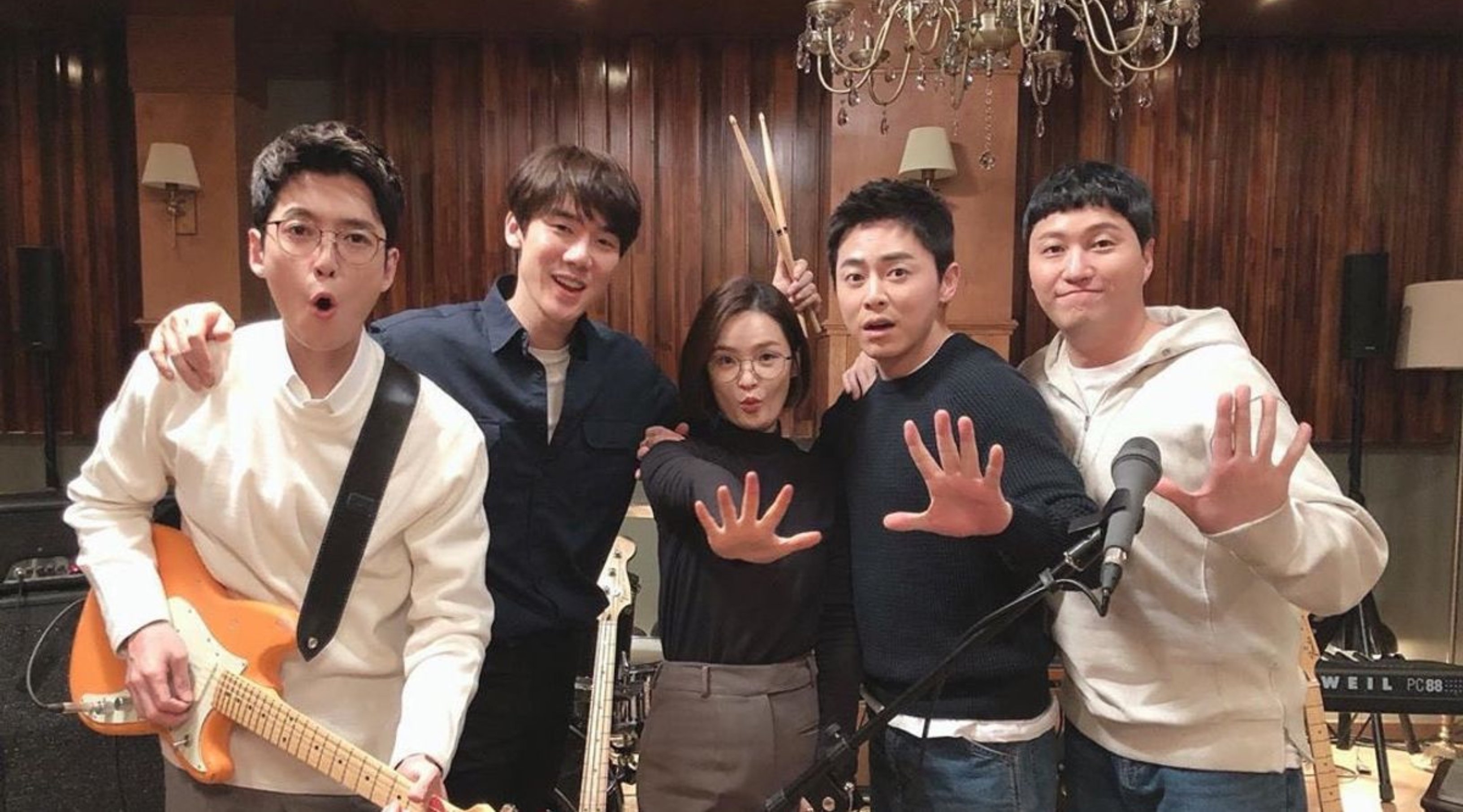 'Hospital Playlist' main cast in plain clothes holding musical instruments