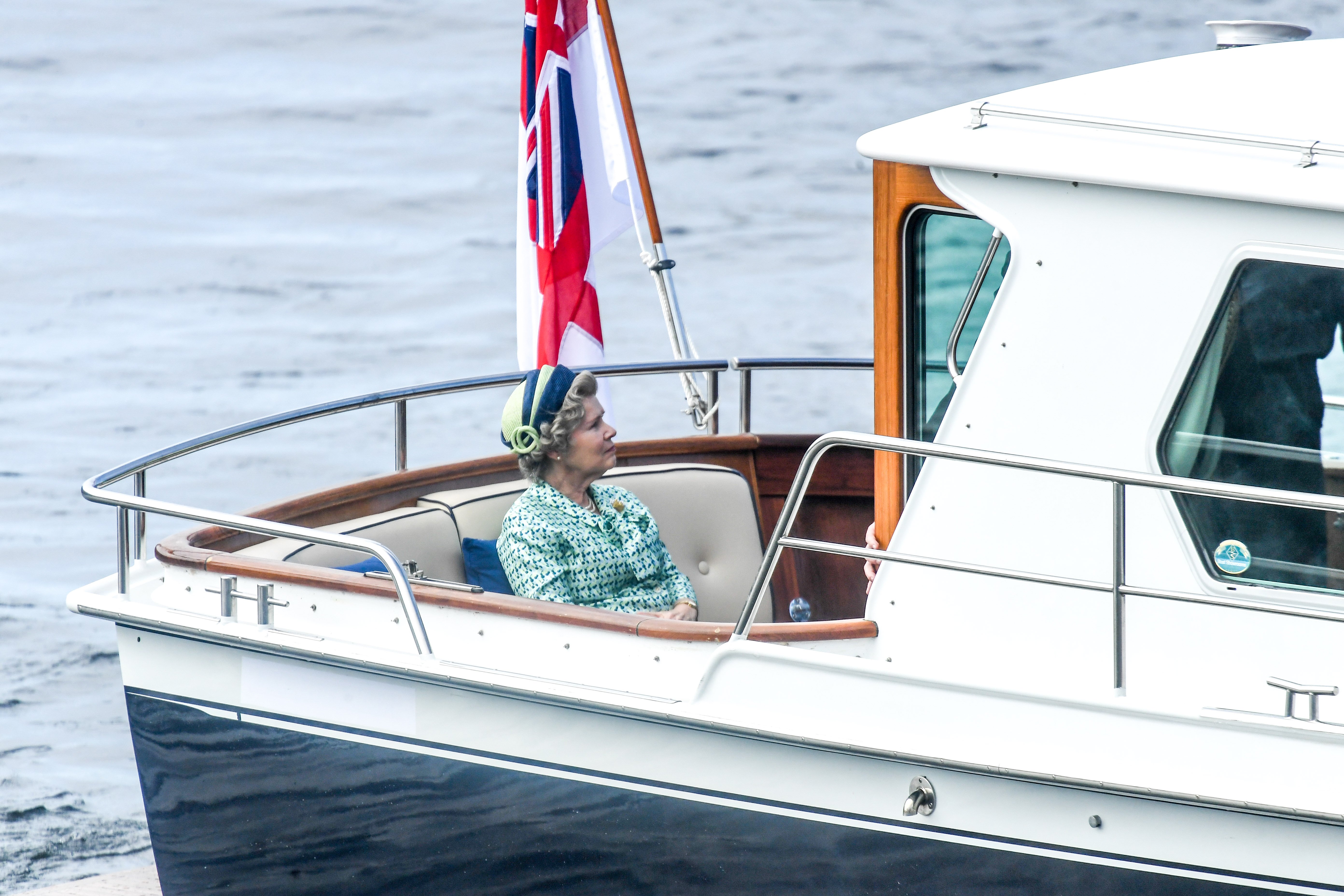 Imelda Staunton who plays Queen Elizabeth II in 'The Crown' Season 5 seen on a boat made to look like a royal yacht