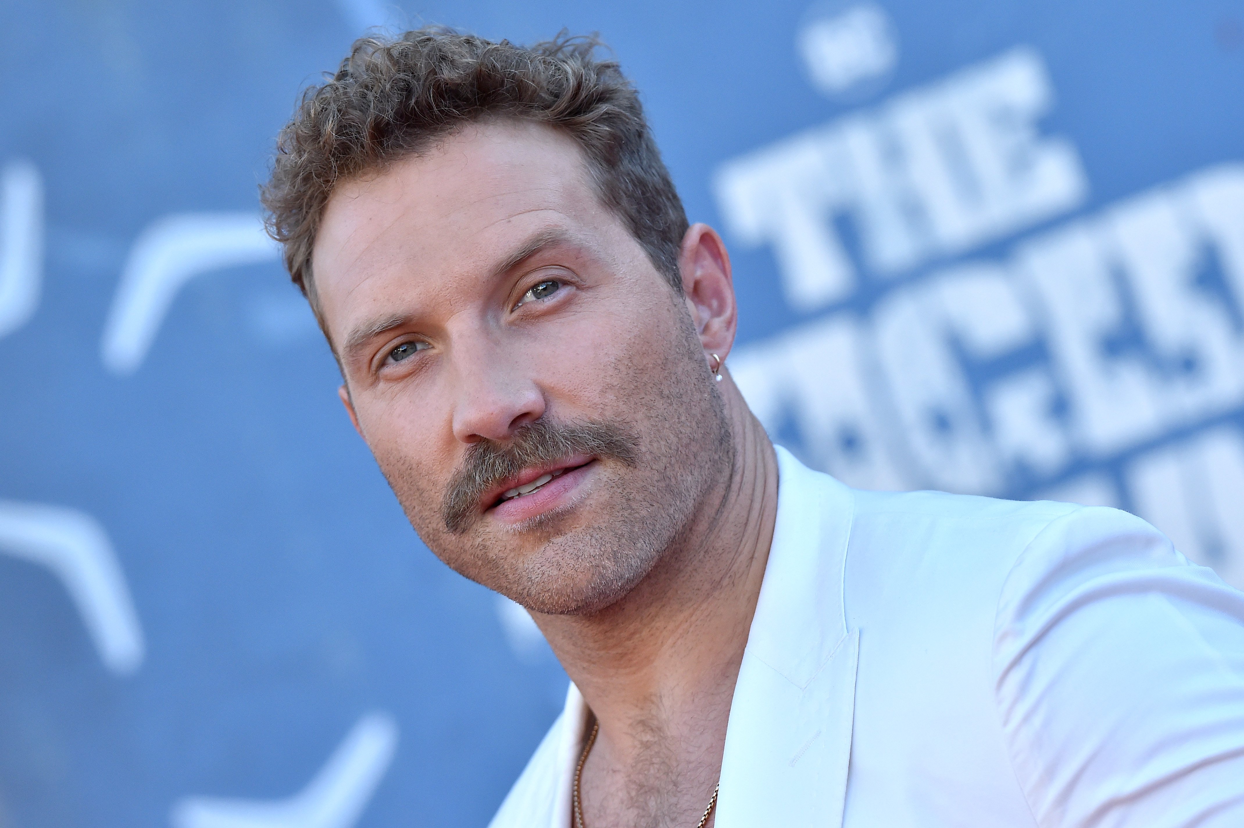 Jai Courtney sports a mustache at The Suicide Squad premiere