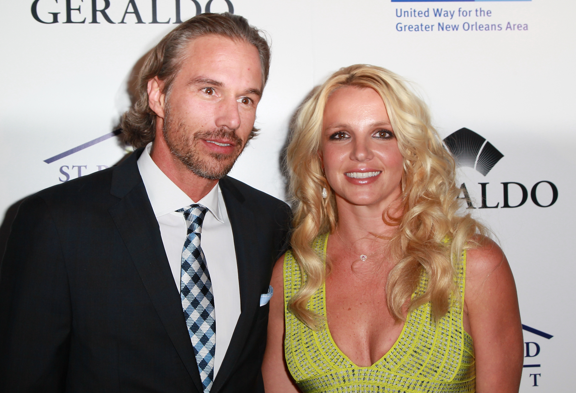 Britney Spears posing with her ex-fiancé Jason Trawick at an event in 2011