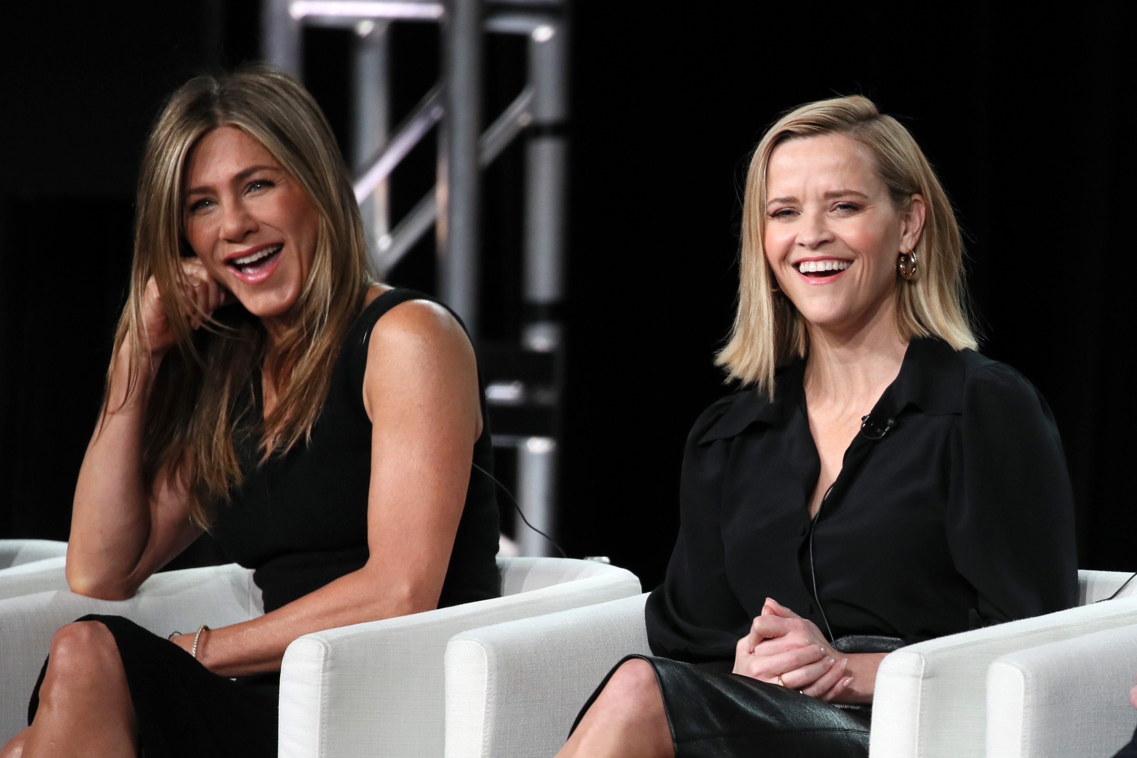 PASADENA, CALIFORNIA - JANUARY 19: Jennifer Aniston and Reese Witherspoon of "The Morning Show" speak onstage during the Apple TV+ segment of the 2020 Winter TCA Tour at The Langham Huntington, Pasadena on January 19, 2020 in Pasadena, California.
