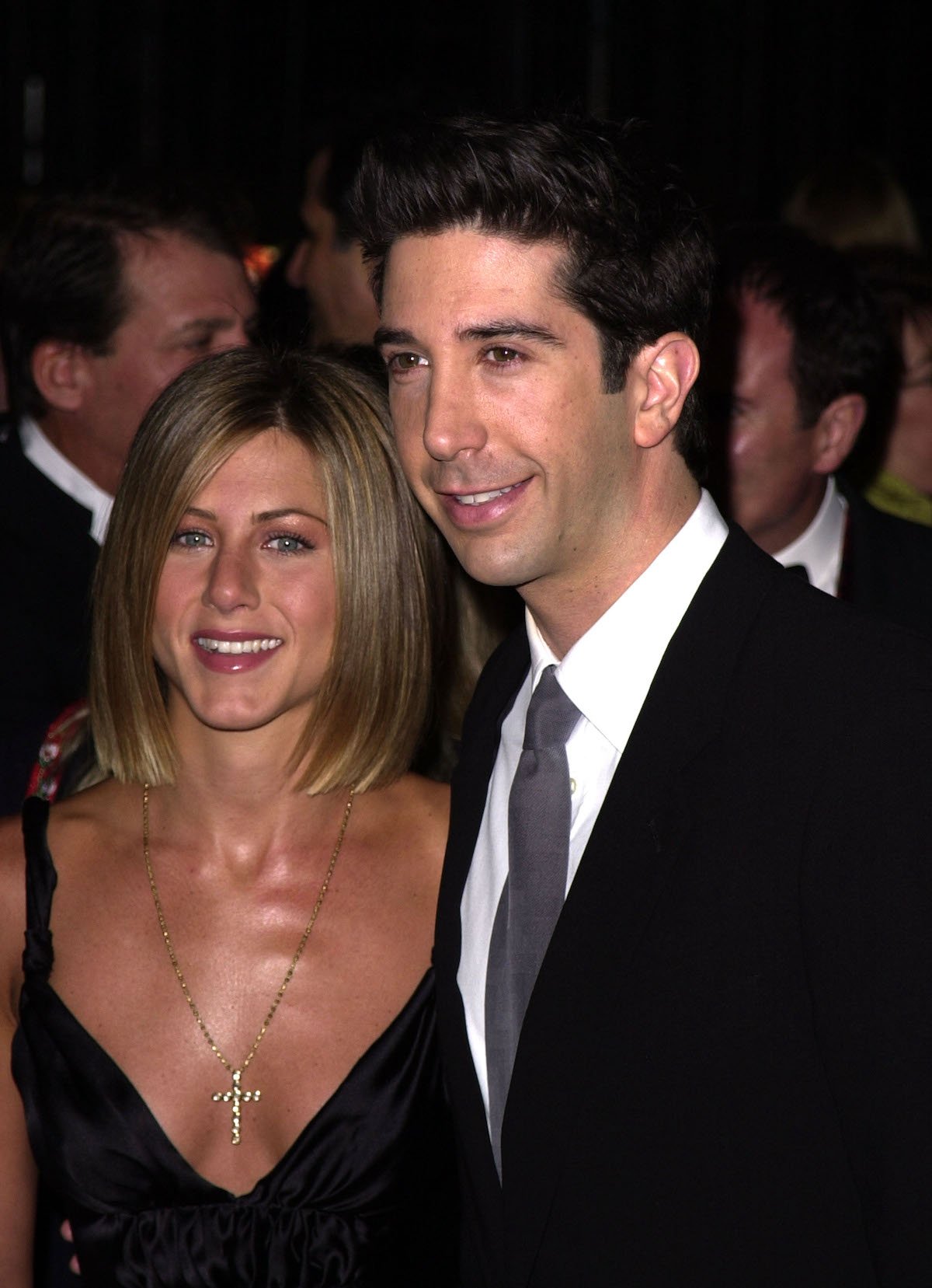 Jennifer Aniston and David Schwimmer dressed in black, standing side by side at a formal event.