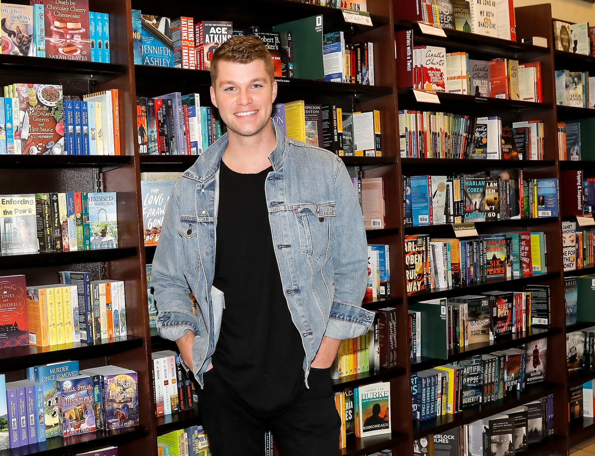 Jeremy Roloff from 'Little People, Big World' smiling in a bookstore 