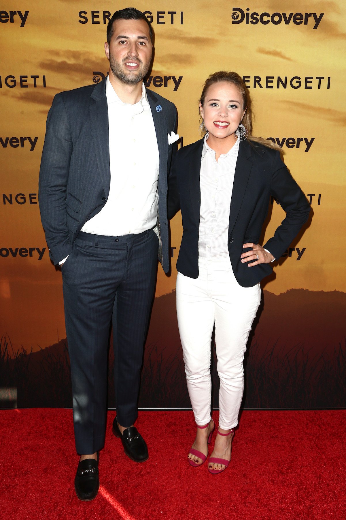 Jeremy Vuolo and Jinger Duggar pose on the red carpet in 2019