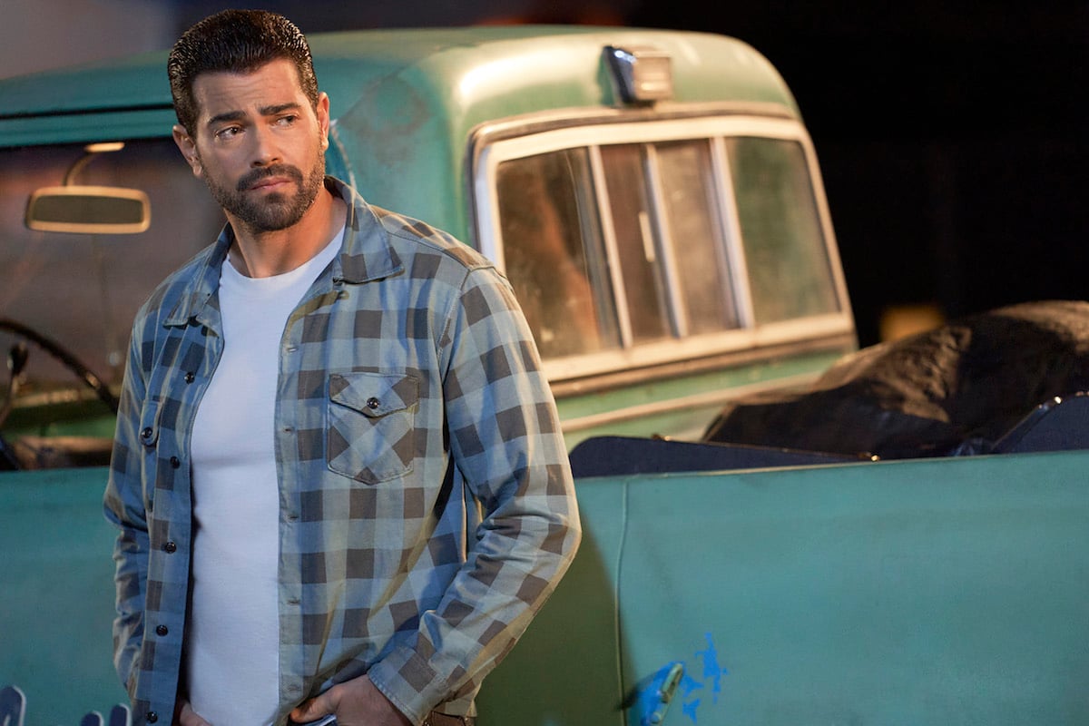 Trace (Jesse Metcalfe) leaning against truck in 'Chesapeake Shores'
