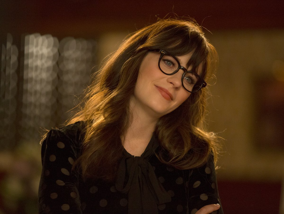 Zooey Deschanel as Jess from 'New Girl' smiling and wearing glasses