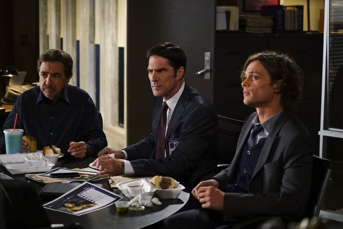 Joe Mantegna as David Rossi, Thomas Gibson as Aaron Hotchner, and Matthew Gray Gubler as Dr. Spencer Reid sitting together in 'Criminal Minds'