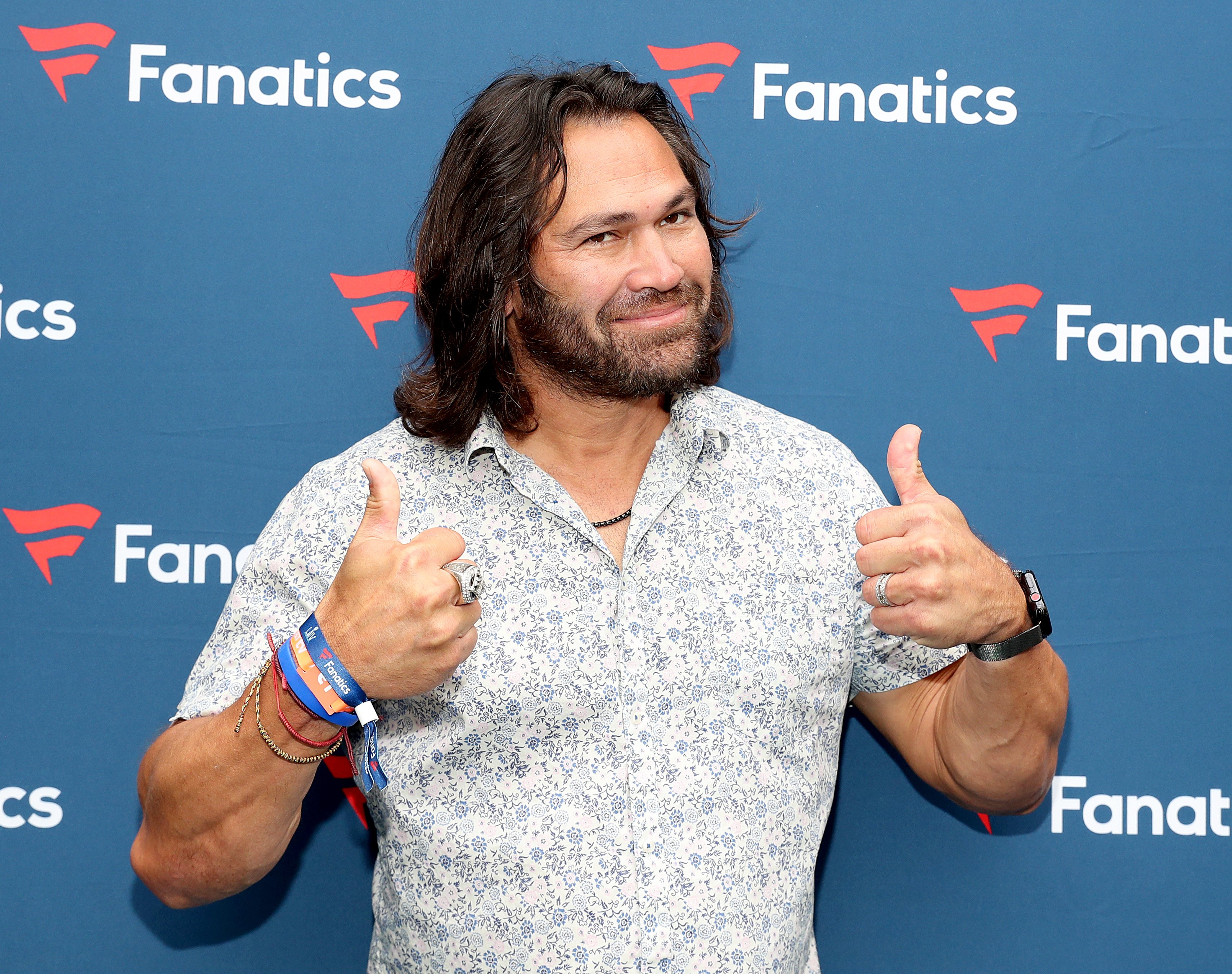 Johnny Damon posing with his thumbs up at Michael Rubin's Super Bowl party