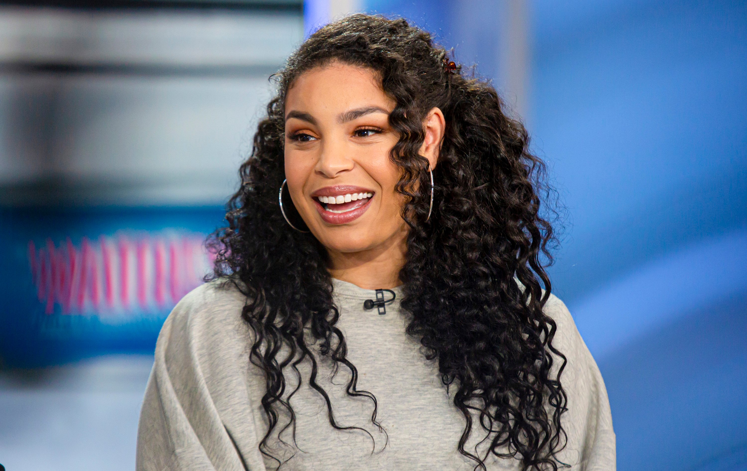 Jordin Sparks, whose new movie is part of Hallmark Countdown to Christmas 2021, smiling in a gray top during an interview on 'Today'