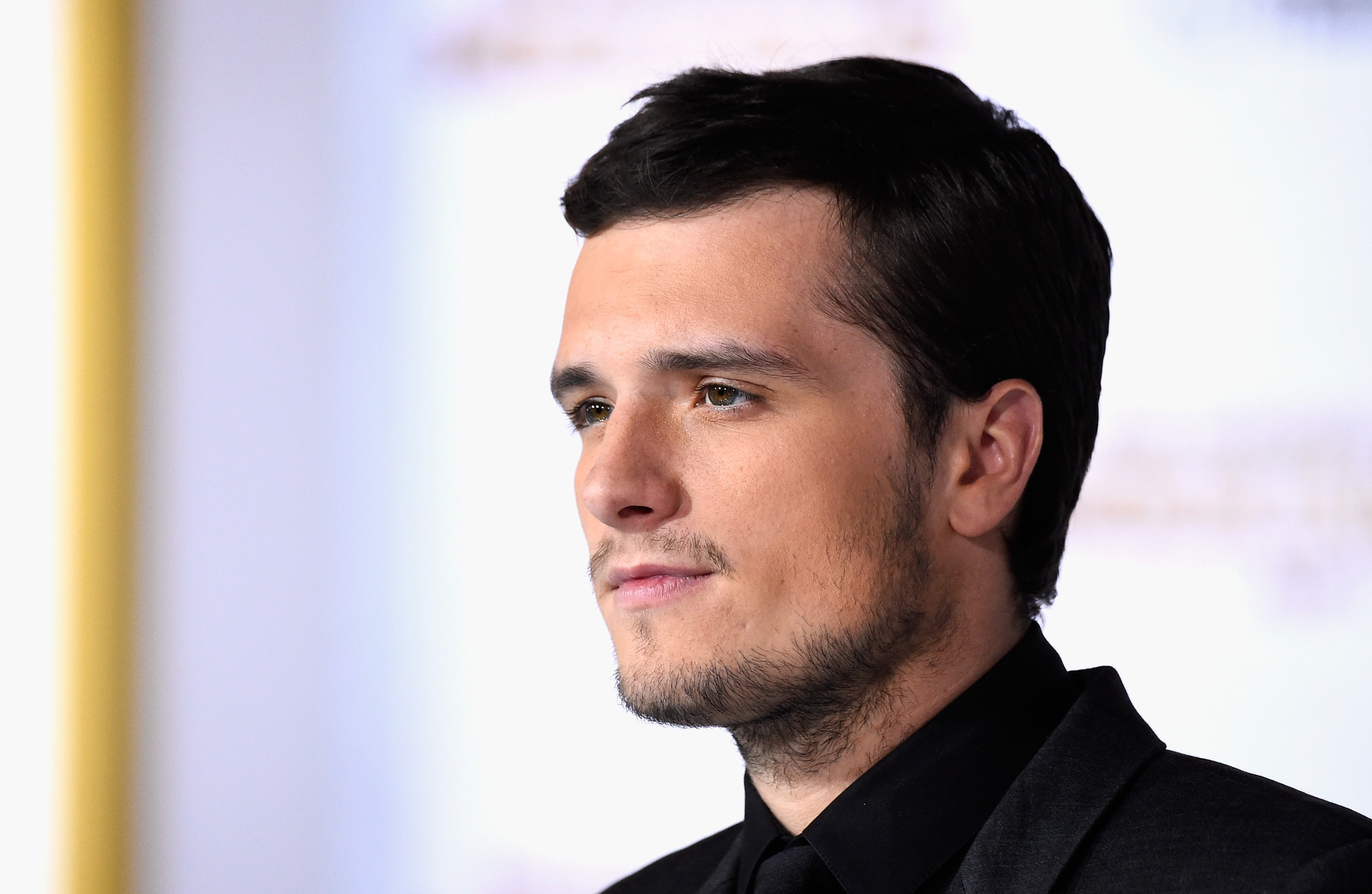 Josh Hutcherson with a stoic expression at the premiere of 'The Hunger Games: Mockingjay - Part 1.'