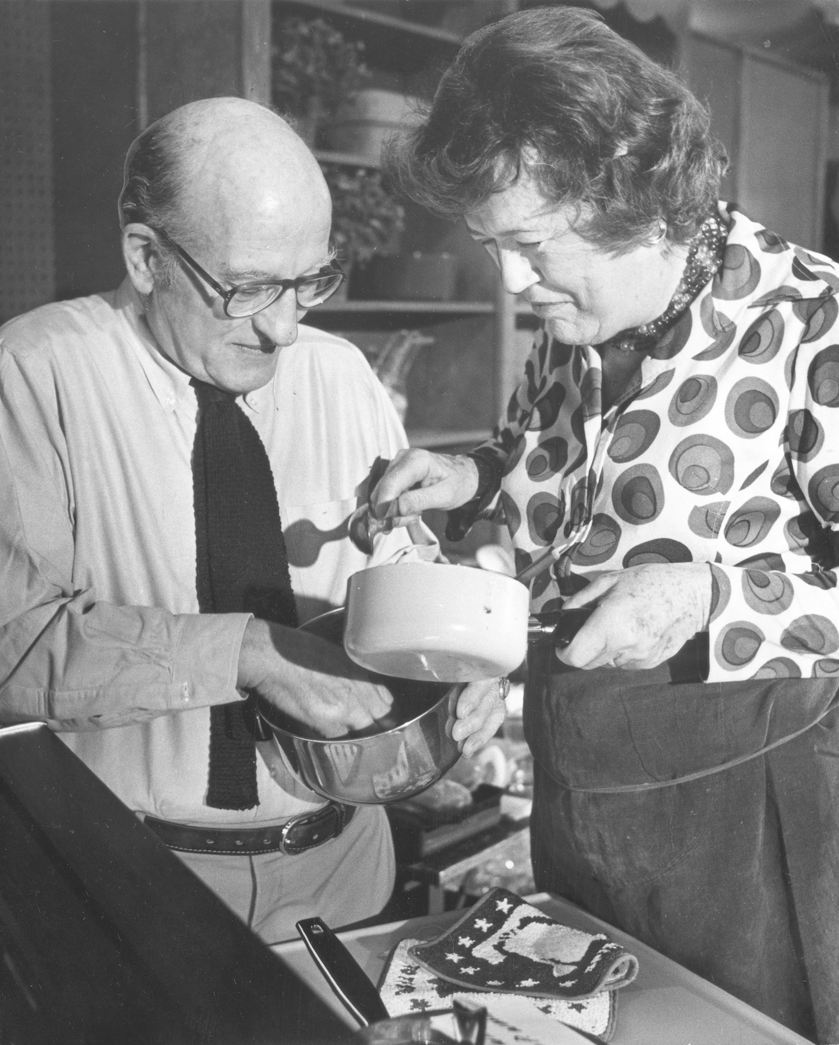 Paul Child and Julia Child are photgraphed during a cooking demonstration at the Shoreham Hotel in 1976
