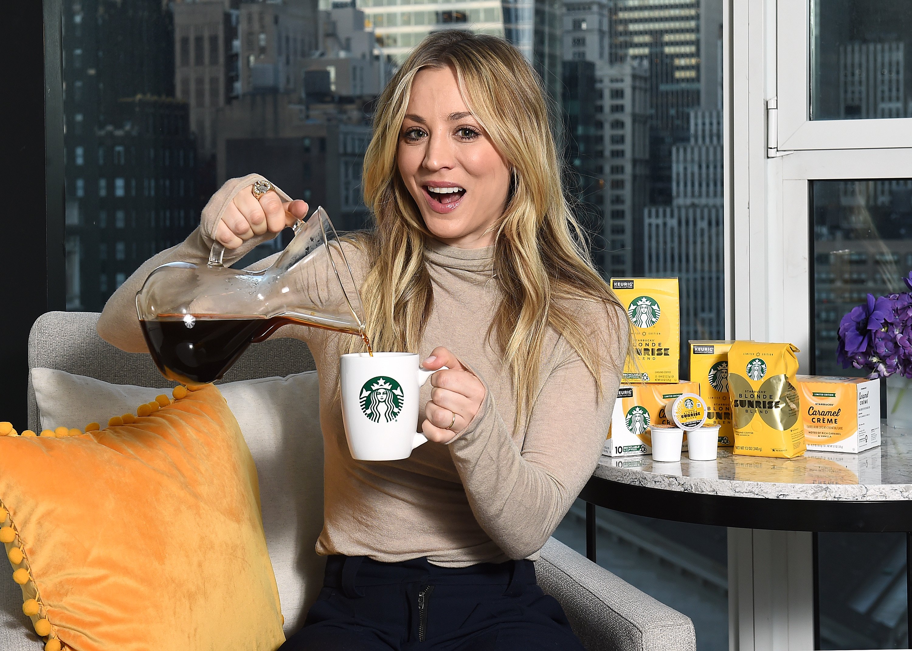 Kaley Cuoco pouring Starbucks coffee