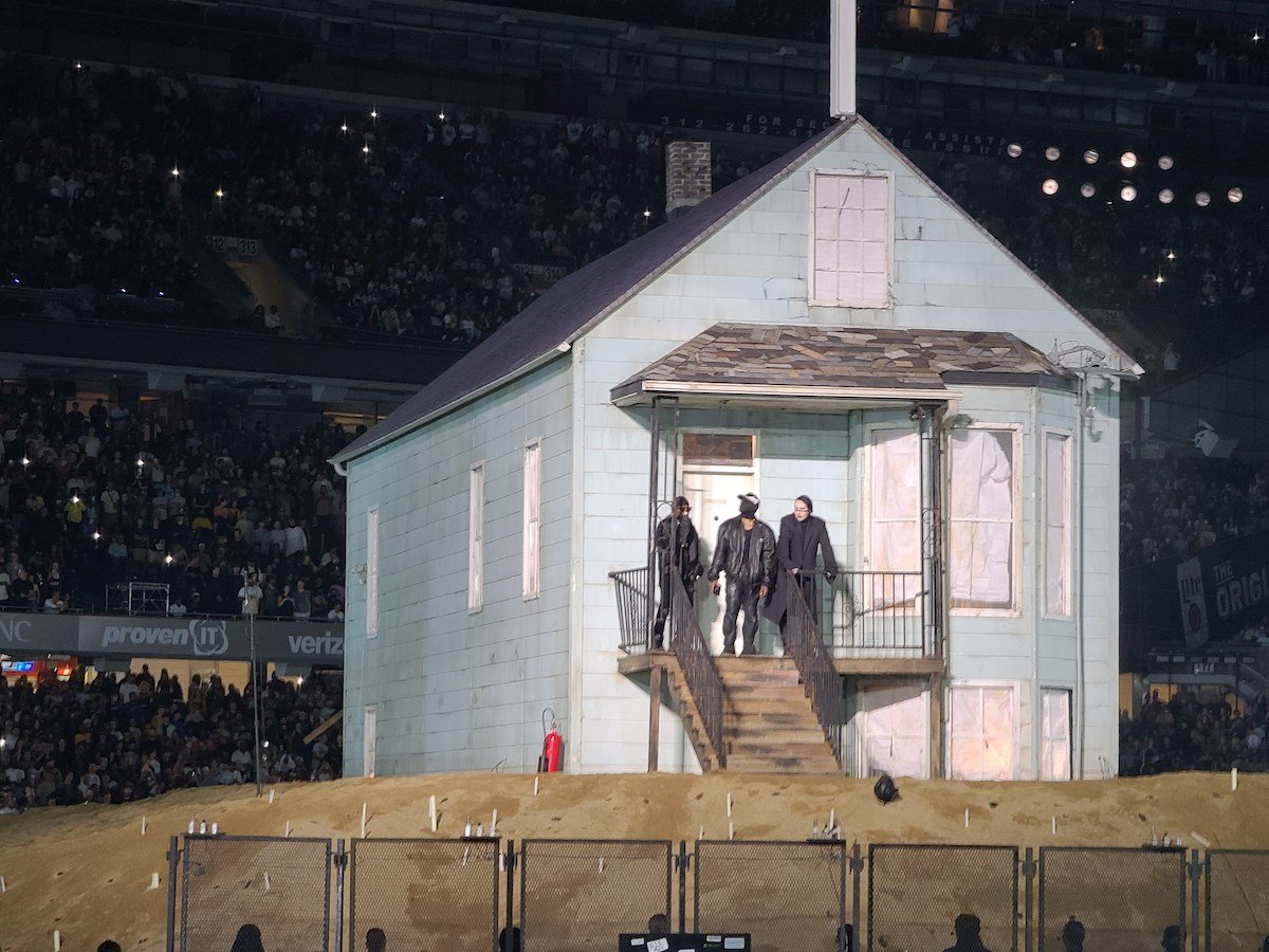 DaBaby, Kanye West and Marilyn Manson dressed in all black in Kanye's replica childhood home perform during the Kanye West Donda event on August 26, 2021 in Chicago, Illinois.