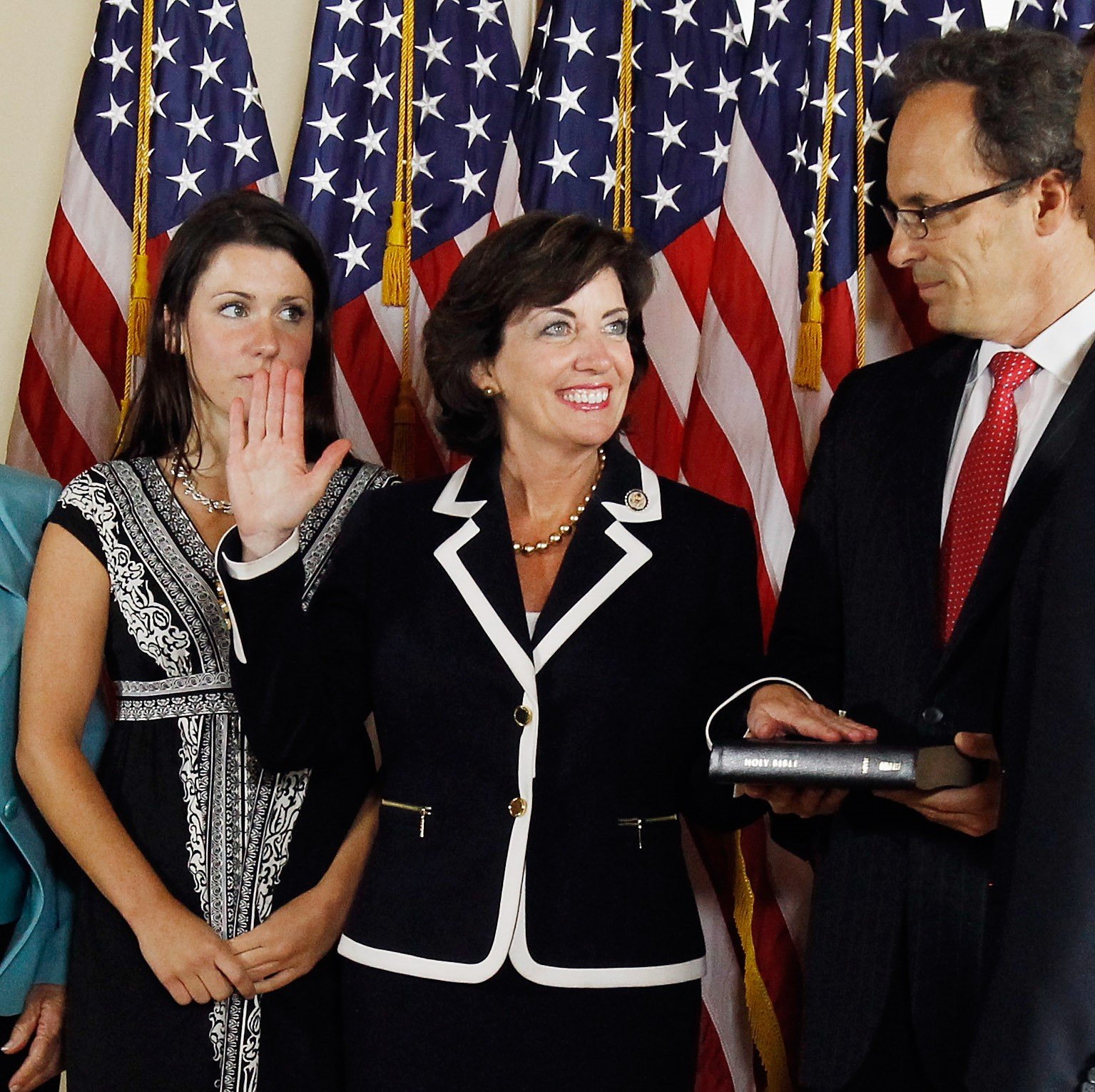 Kathy Hochul with her daughter Katie Hochul and husband Bill Hochul during mock swearing-in